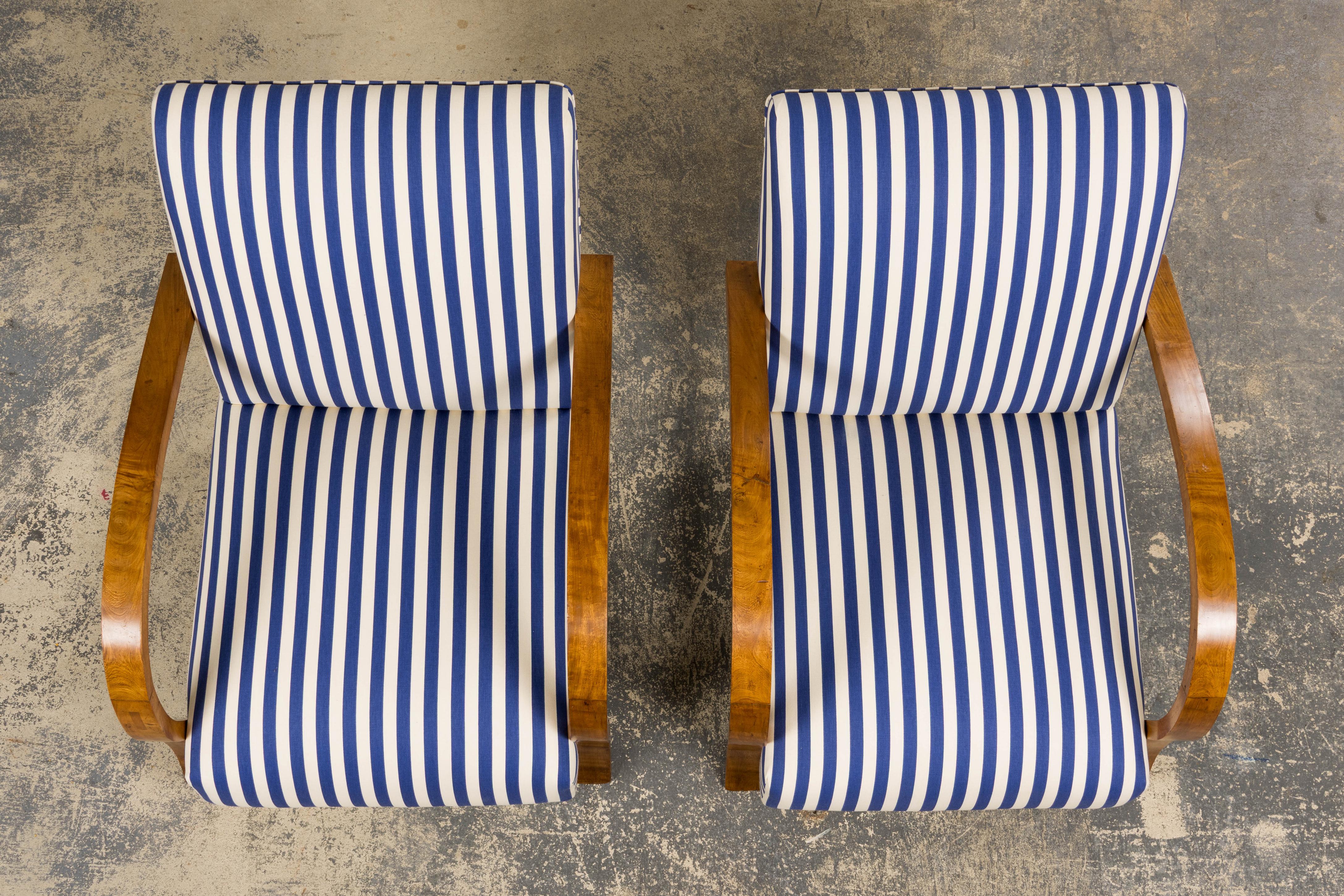 Hand-Carved 1930s French Art Deco Walnut Bridge Arm Lounge Chairs in Blue Stripe - A Pair For Sale