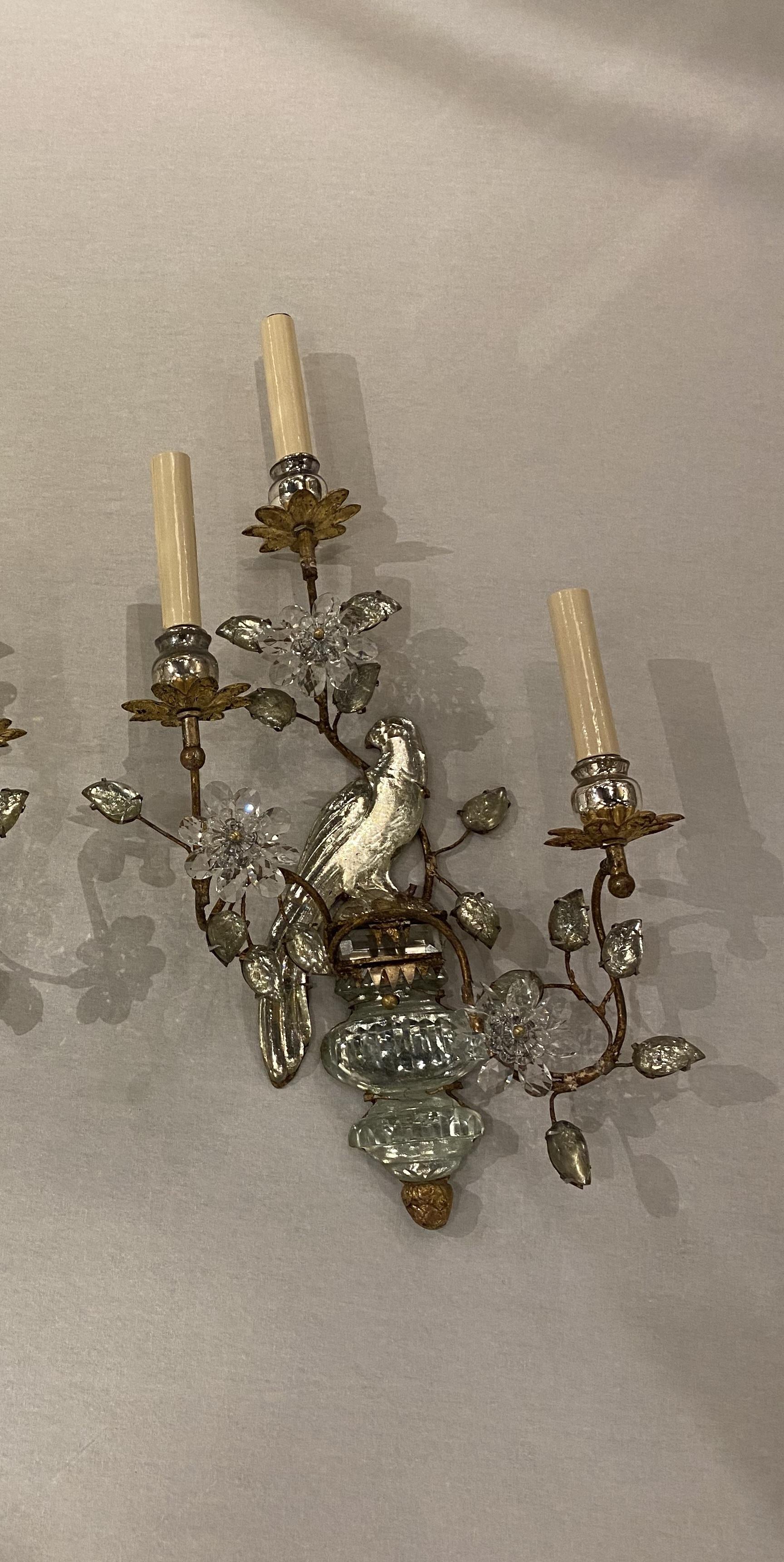 A pair of circa 1930’s French Bagues 3 lights sconces with glass leaves and birds