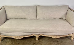1930s French Carved Sofa with Linen Cushions