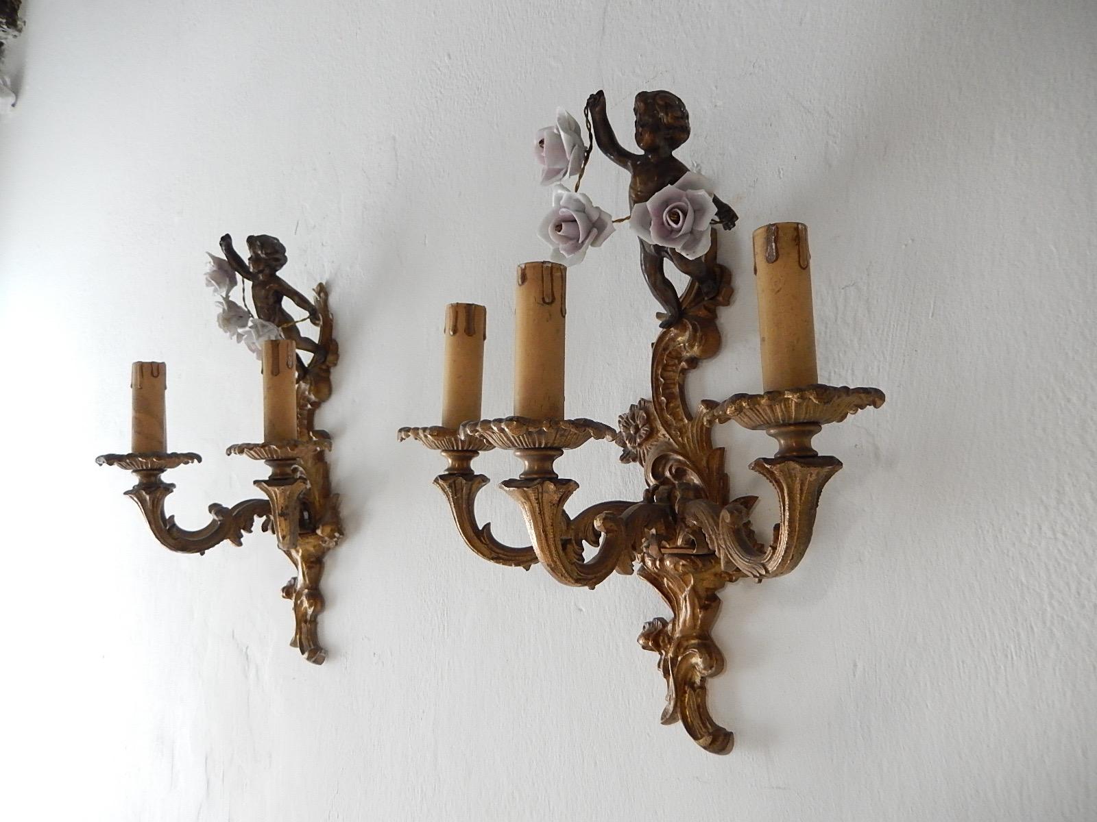 Housing 3 lights each. Will be re-wired with appropriate sockets for country and ready to hang! Heavy cast bronze with great patina, Adorning cherubs on top holding 3 pink roses. Great details of flowers in bronze. Free priority UPS shipping from