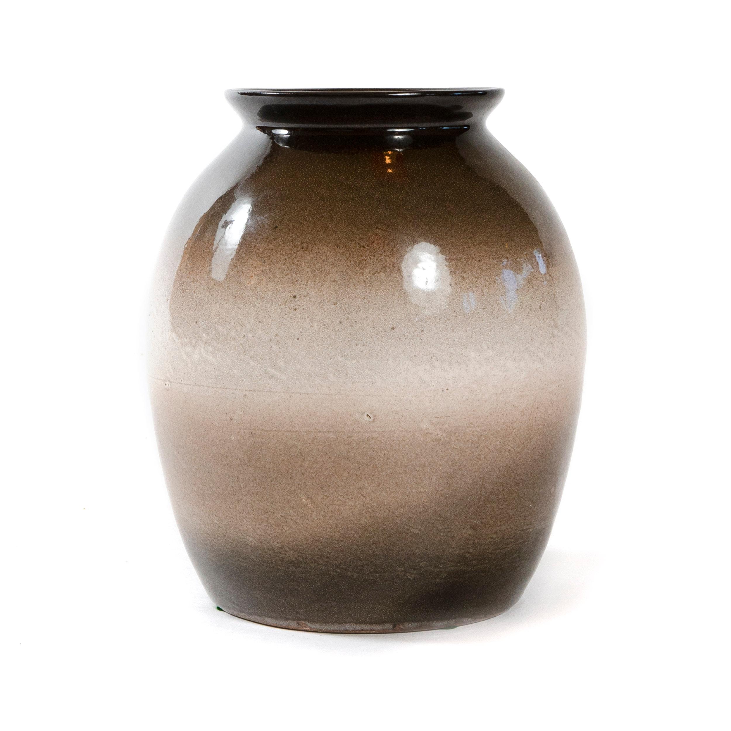 A ceramic vase with a brown-to-white high glaze.