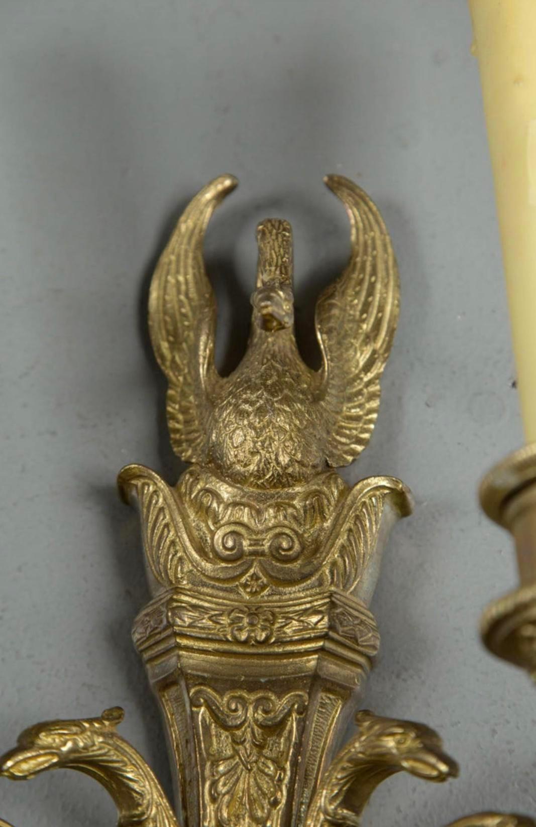 A pair of circa 1930’s French empire style sconces with swan atop and on arms