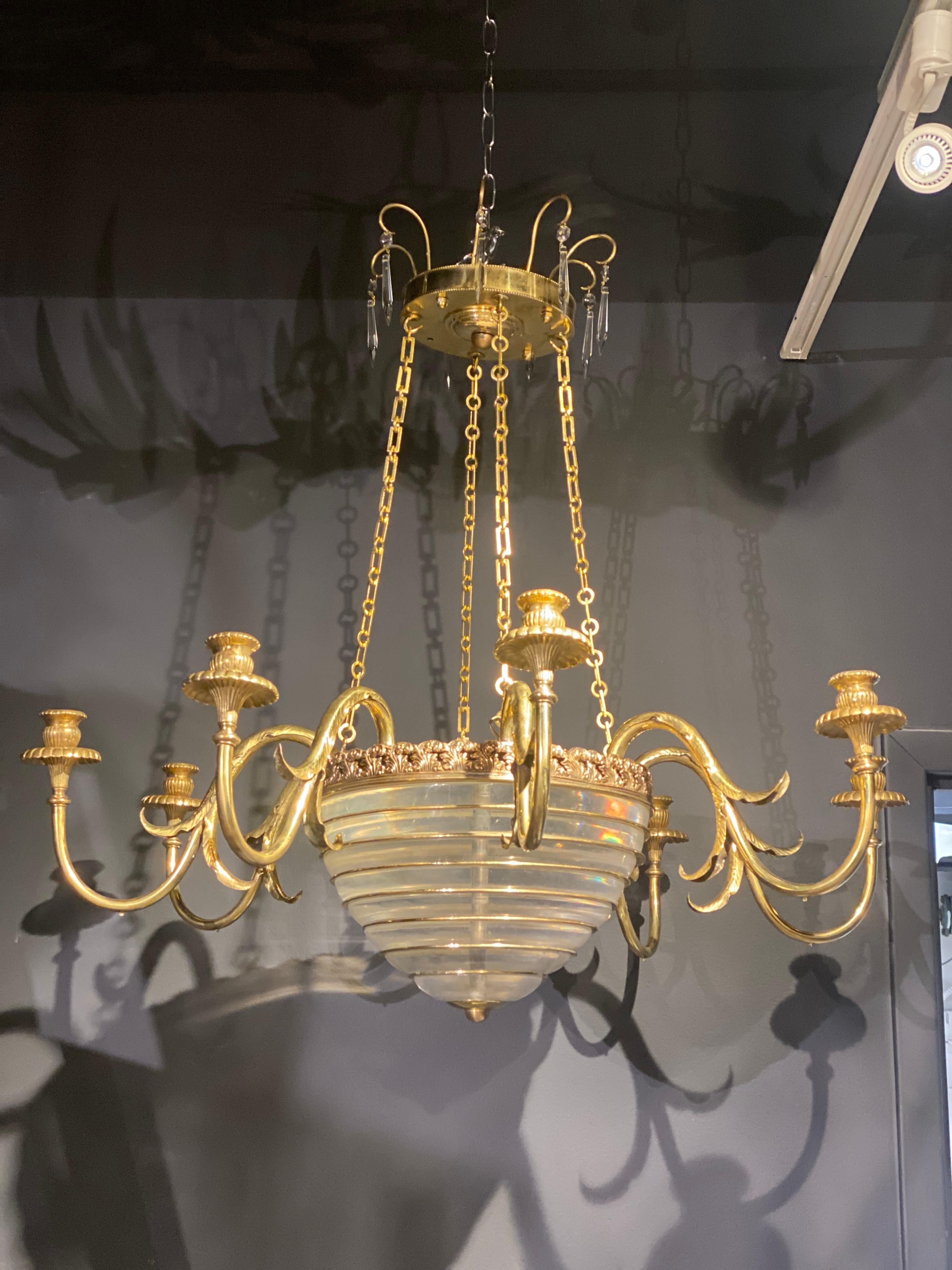 A circa 1930’s French gilt bronze chandelier with 8 lights and crystal body 