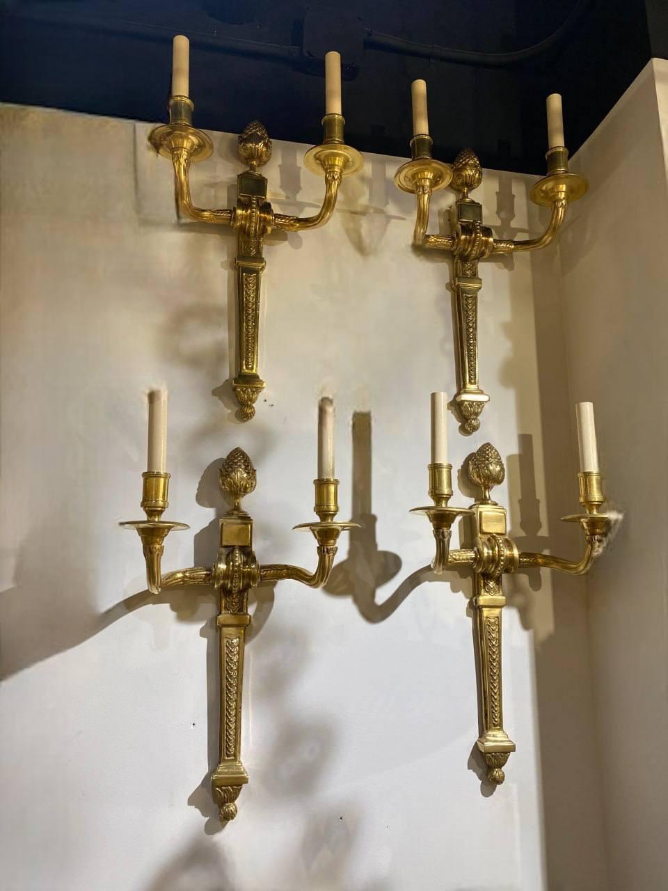 A pair of 1930’s French gilt bronze double lights sconces, original finish and patina, unusual large sized.