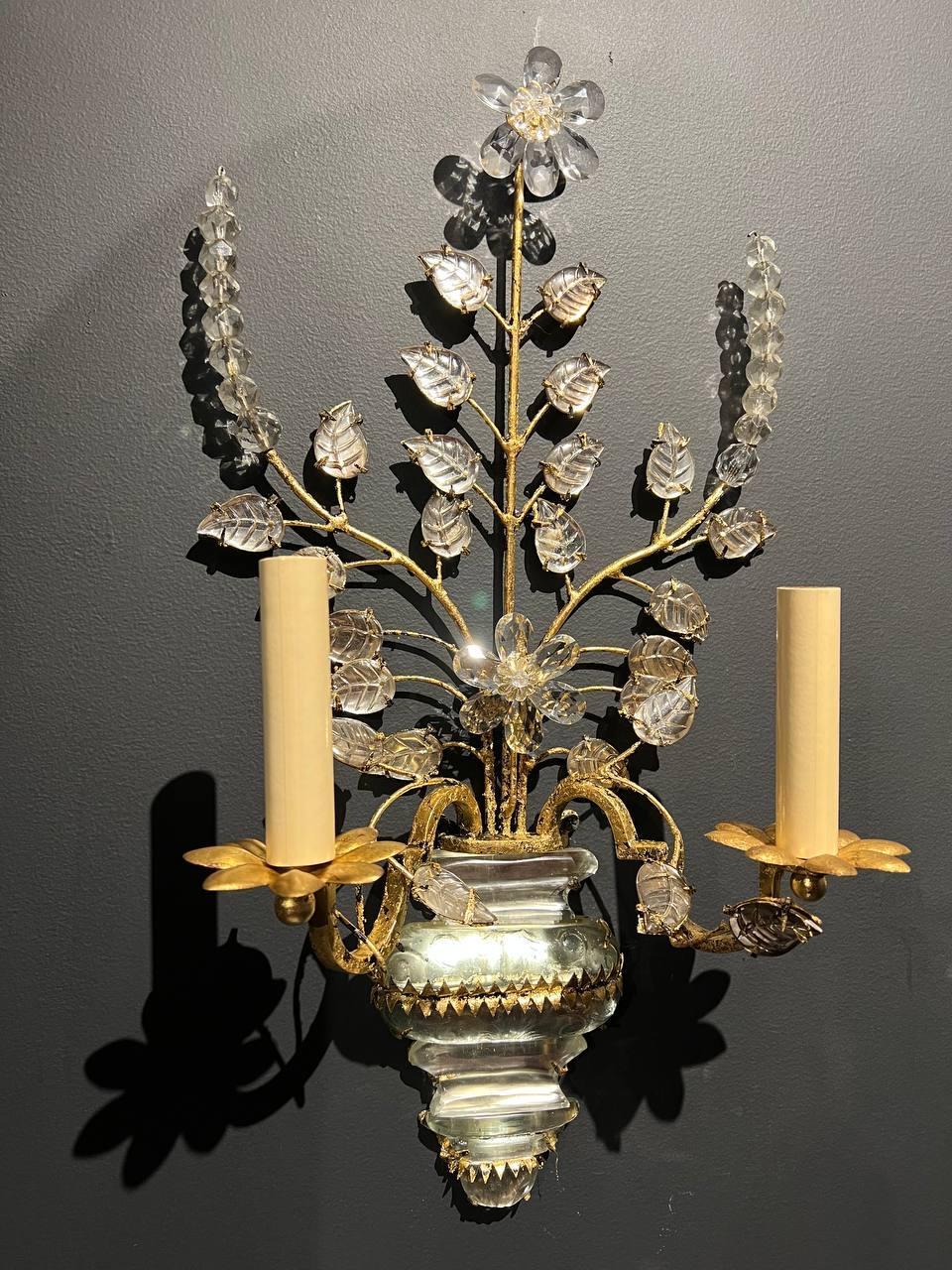 A pair of circa 1930’s french gilt metal sconces with glass leaves and crystal body