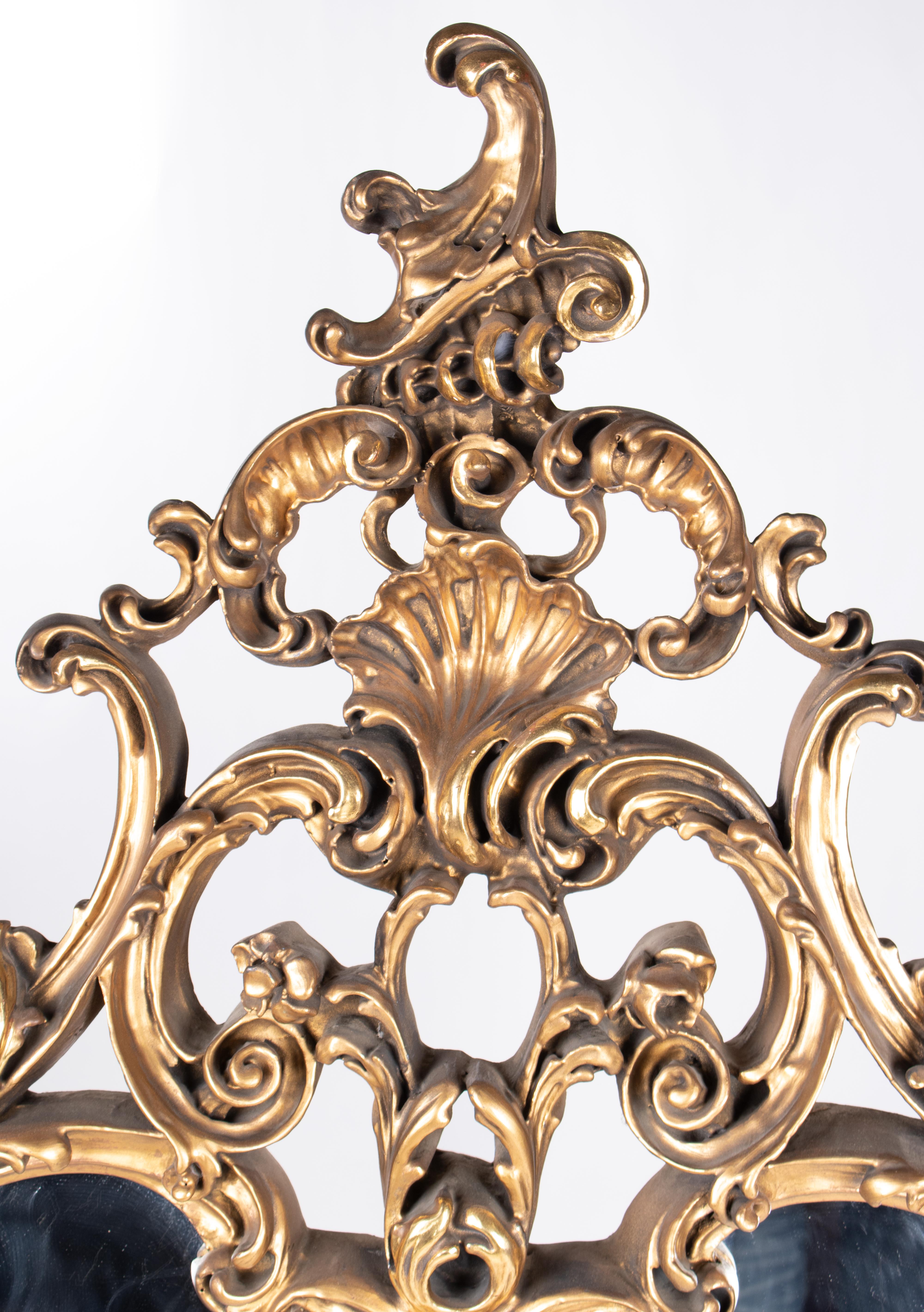 1930s French golden Baroque wooden mirror.
