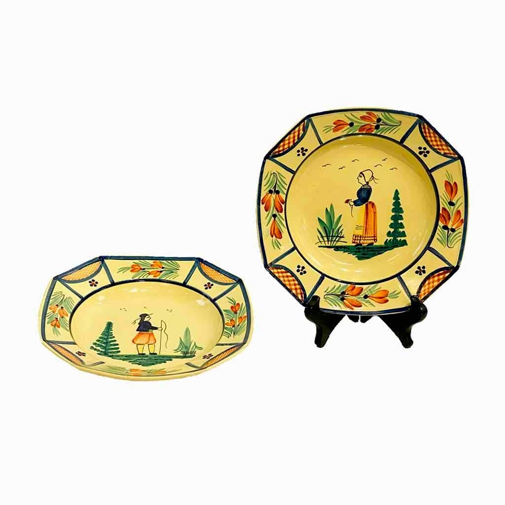 A charming pair of decorative plates that can be used as tableware as well, in the sought-after yellow enameled Art Deco Quimper pottery, with the attractive octagonal shape, representing man and woman dressed in the typical traditional Brittany