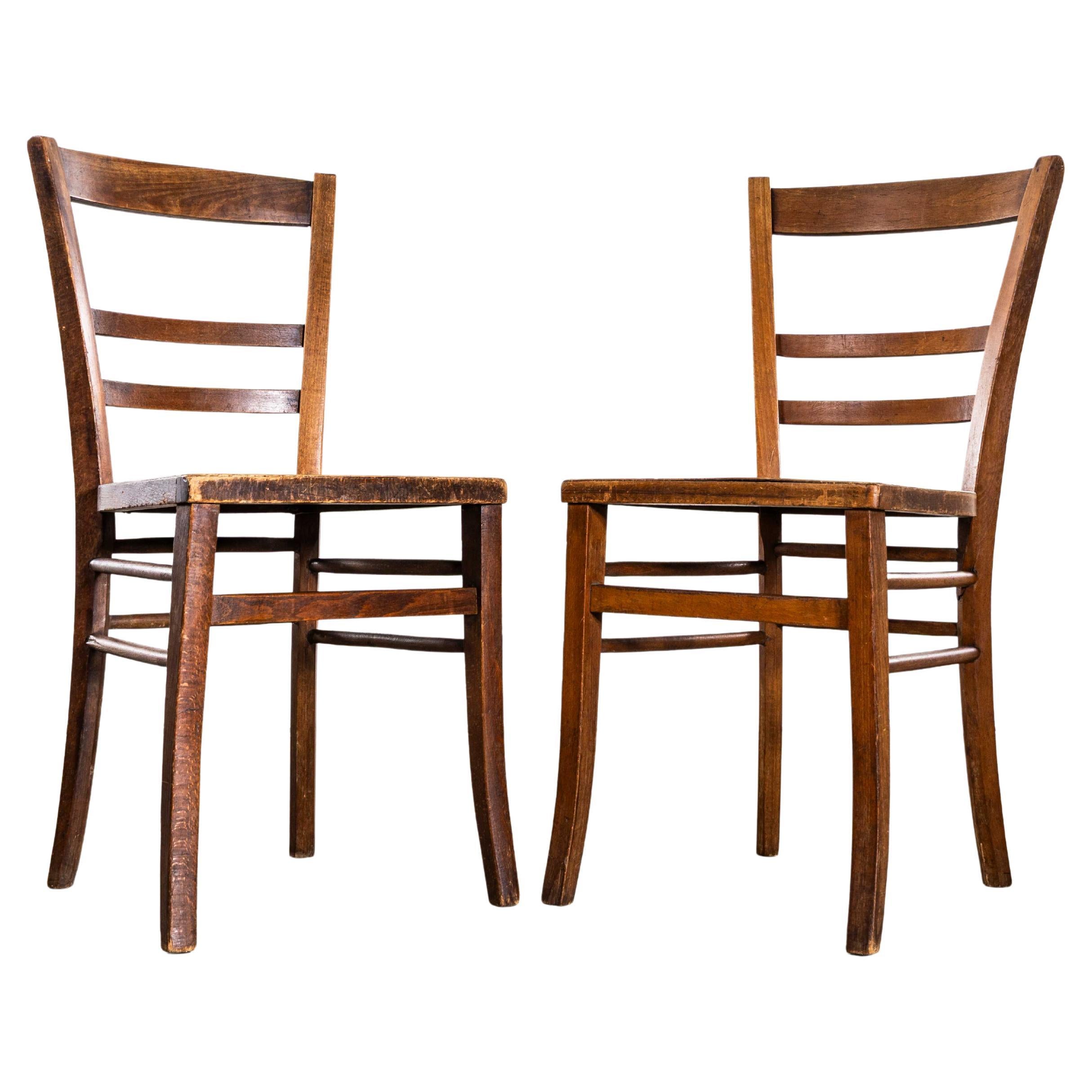 Chaises de salle à manger françaises à dossier en échelle et à assise perforée des années 1930 - Paire