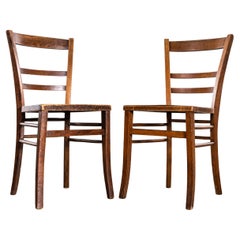 Chaises de salle à manger françaises à dossier en échelle et à assise perforée des années 1930 - Paire