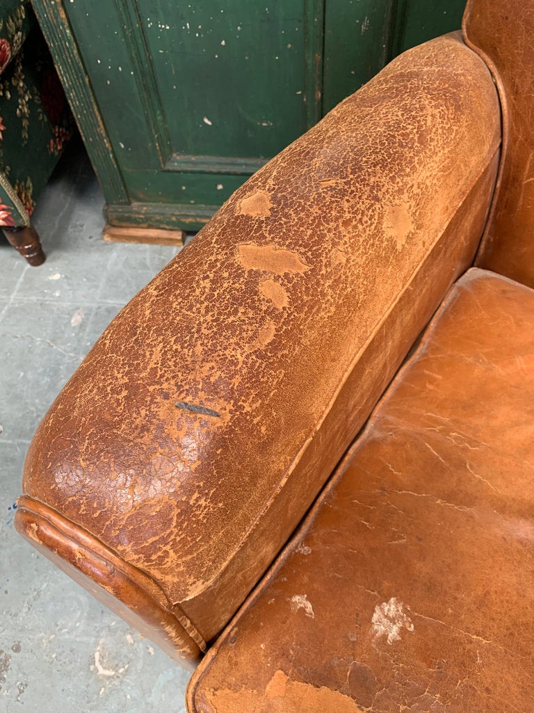 A single, classic leather club chair from 1930s France.
