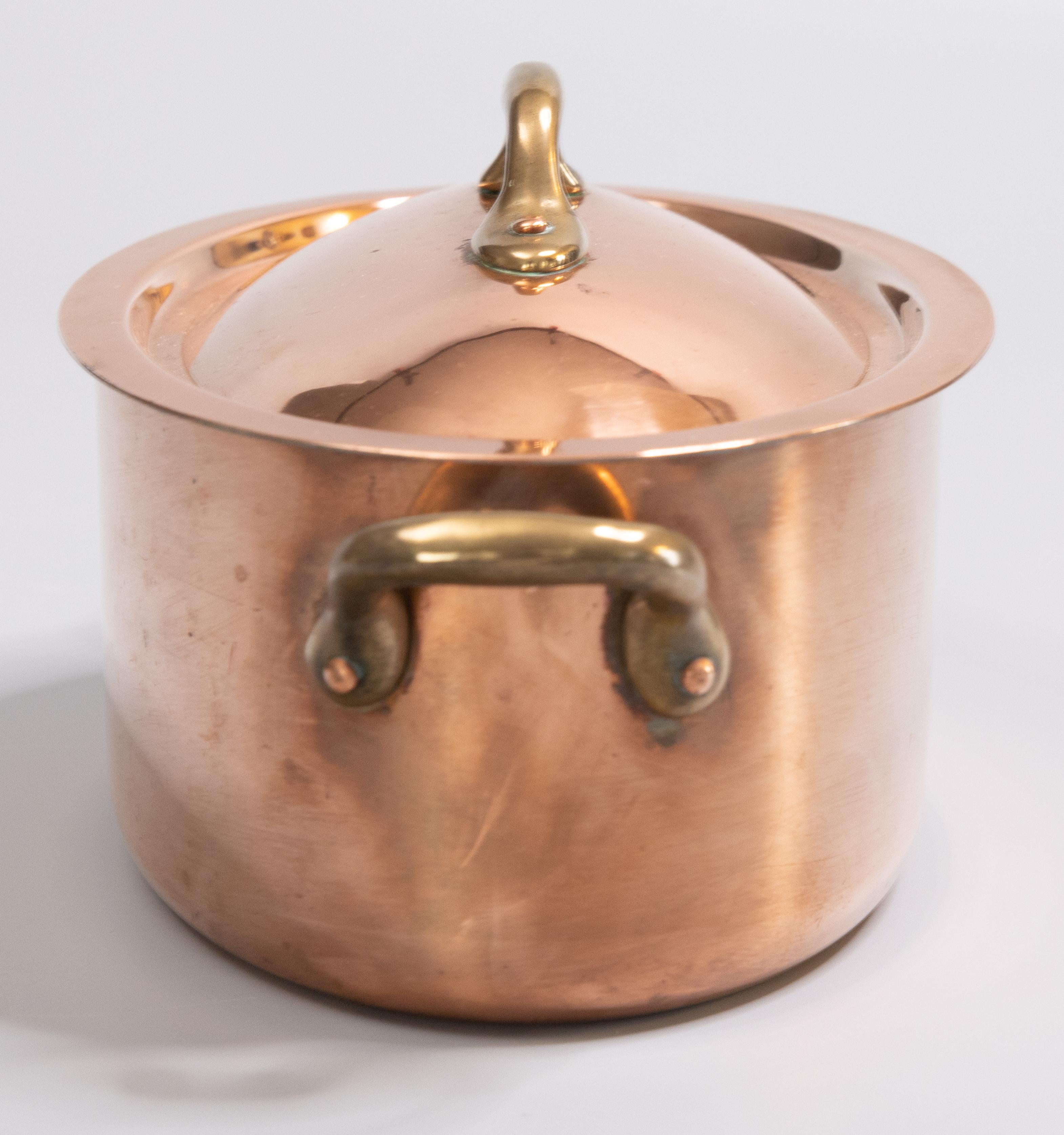 A gorgeous early 20th century petite French oval lidded copper pot, circa 1930. Marked 