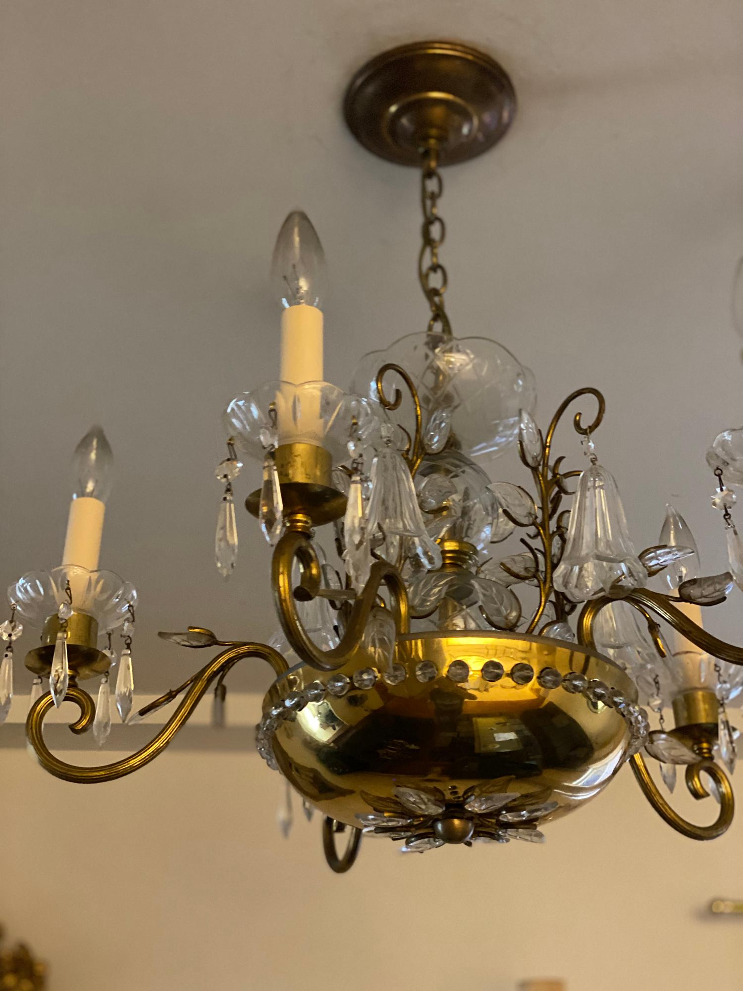 A circa 1930’s French Bagues chandelier with interior lights and glass flowers and leaves. In very good vintage condition, with original condition unaltered. 

Dealer: G302YP 