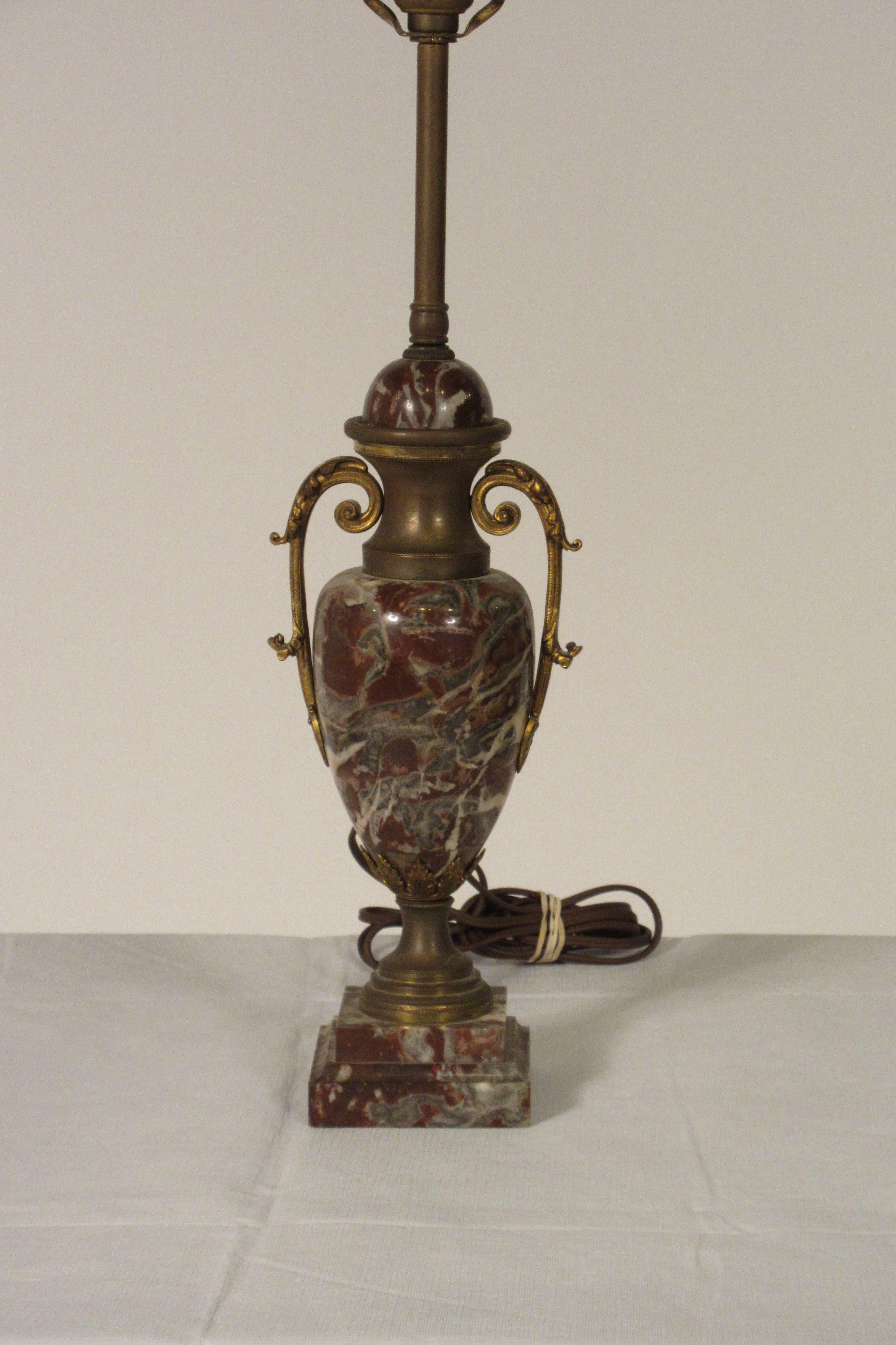 1930s French marble table lamp with brass accents.