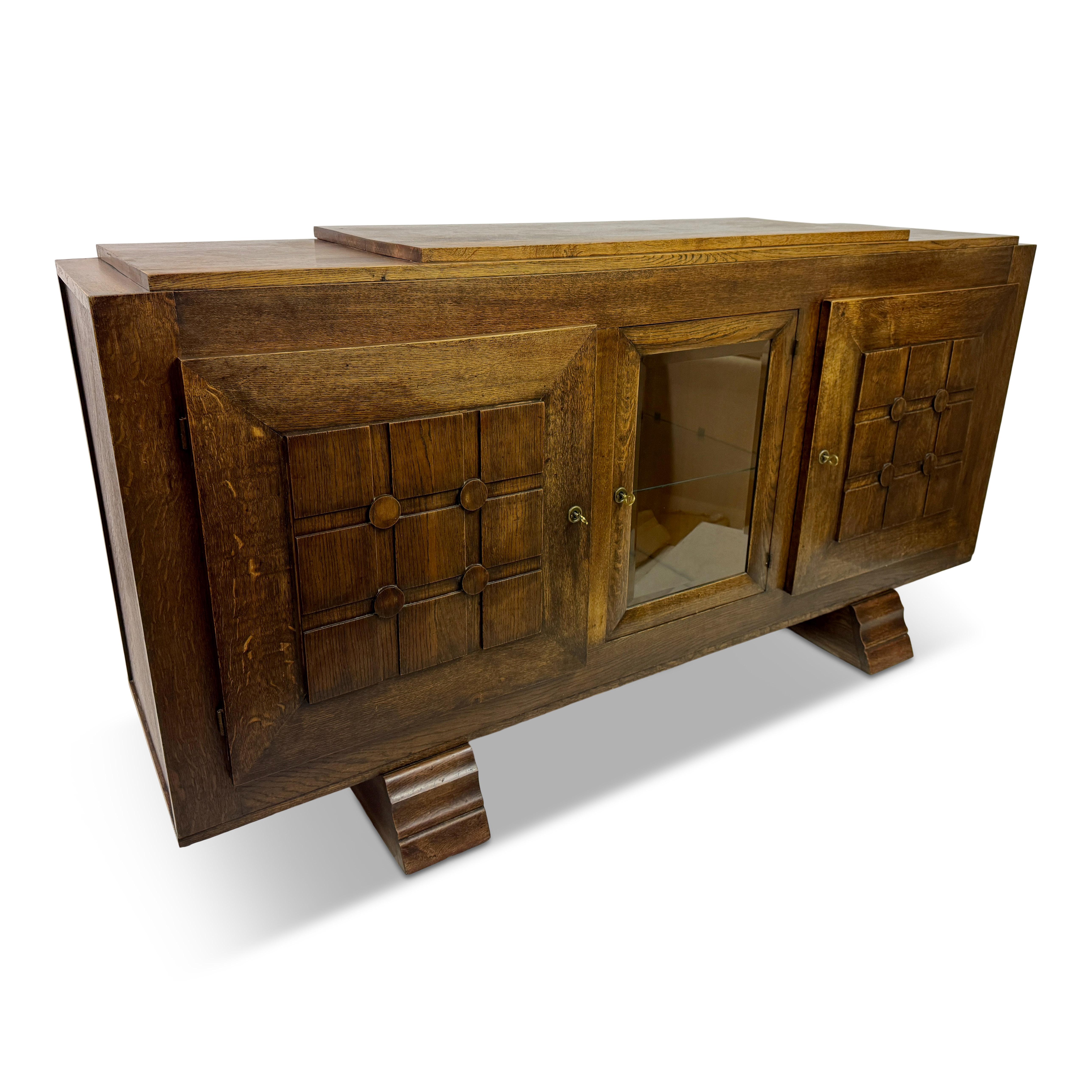 Sideboard or credenza

Oak

By Gaston Poisson

Graphic door fronts

Shelves and drawers inside

France 1930s/1940s