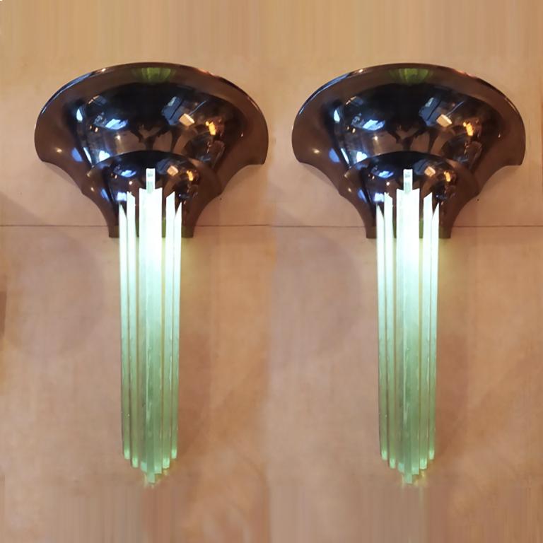 Astonishing original Art Deco sconces with cascading Gobain glass elements with sculptural uplights in brass.