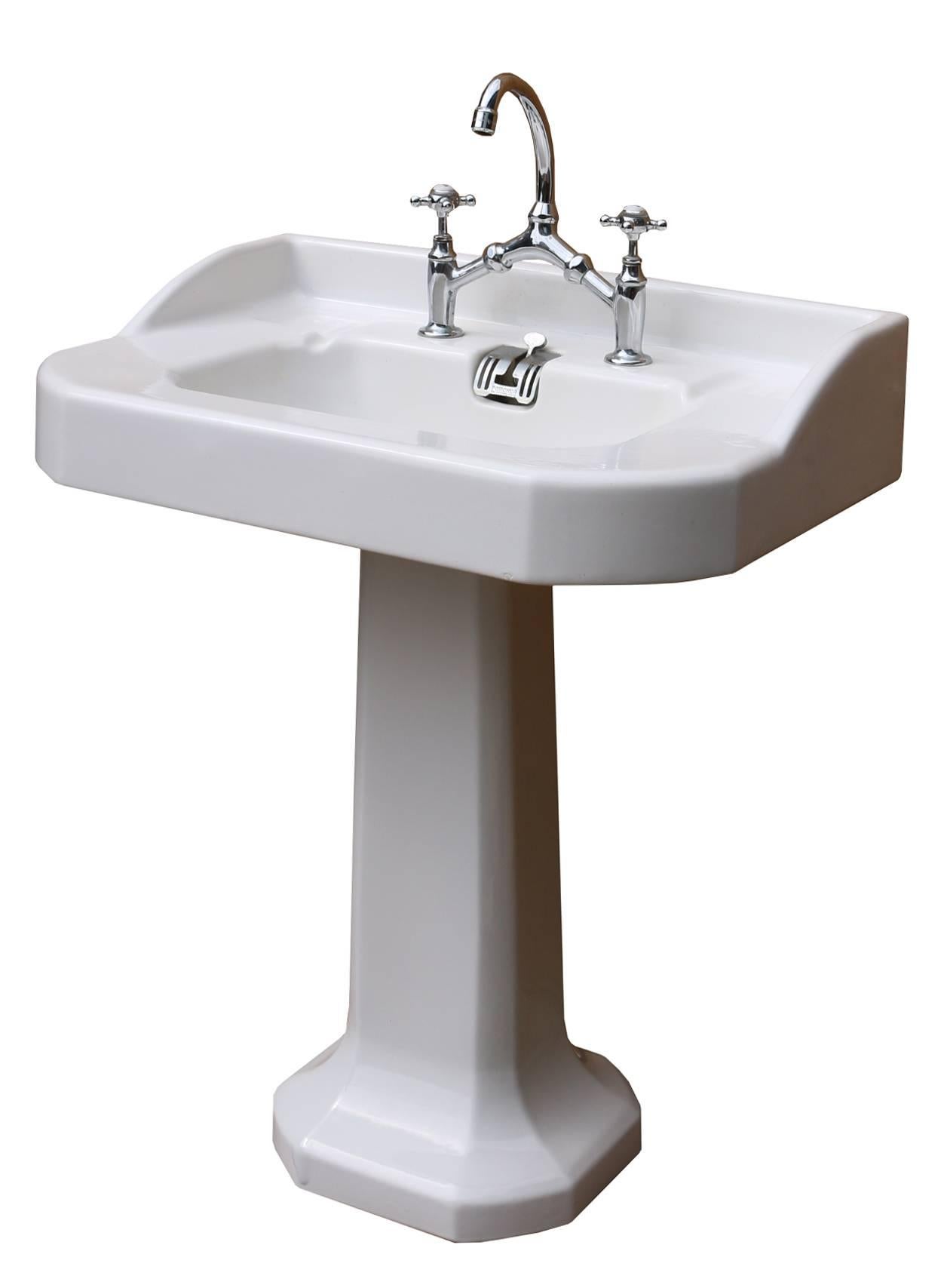This basin is in very good condition for its age. The taps are untested and will require attention. There is a run in the glaze at the base o the pedestal. 
Height 86.5 cm (excluding taps)
Weight 28 kg.