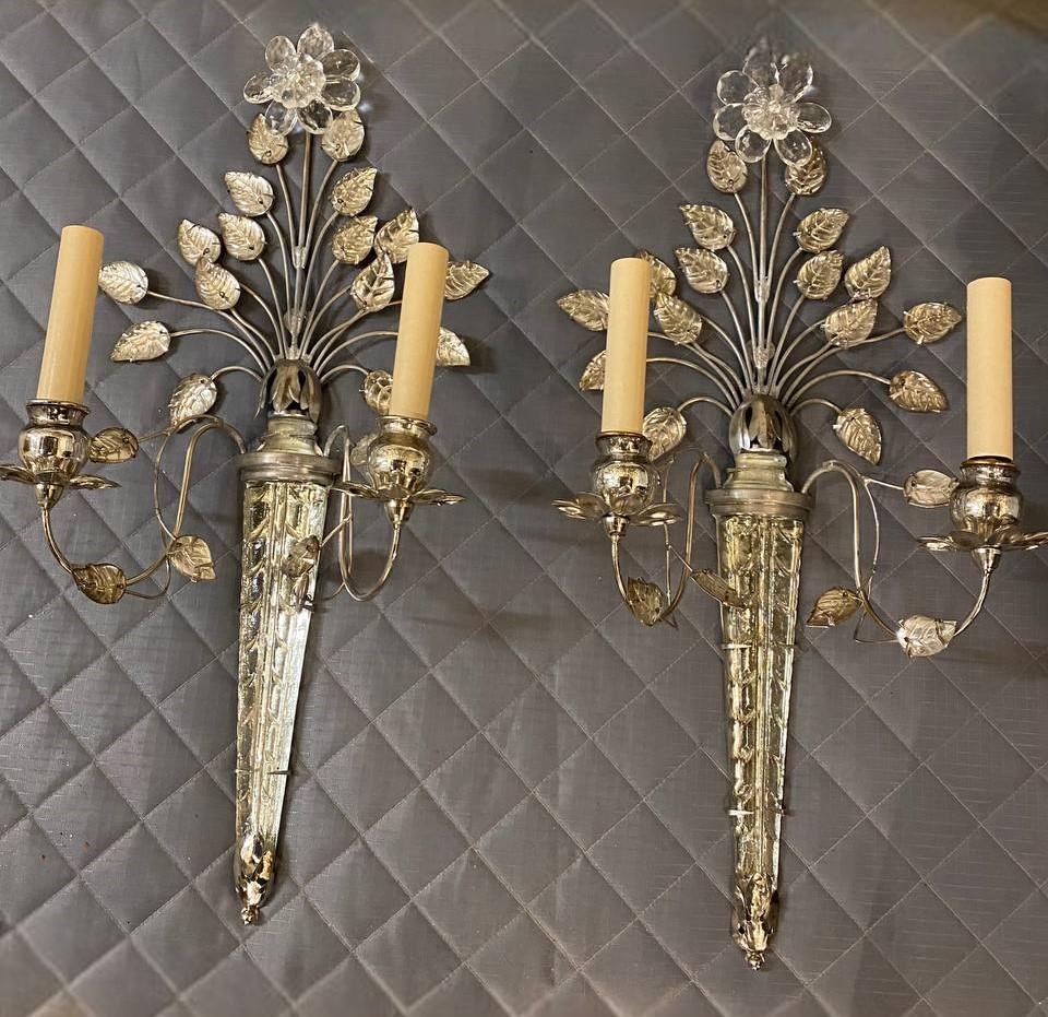A pair of circa 1930’s French double light sconces with flower design 