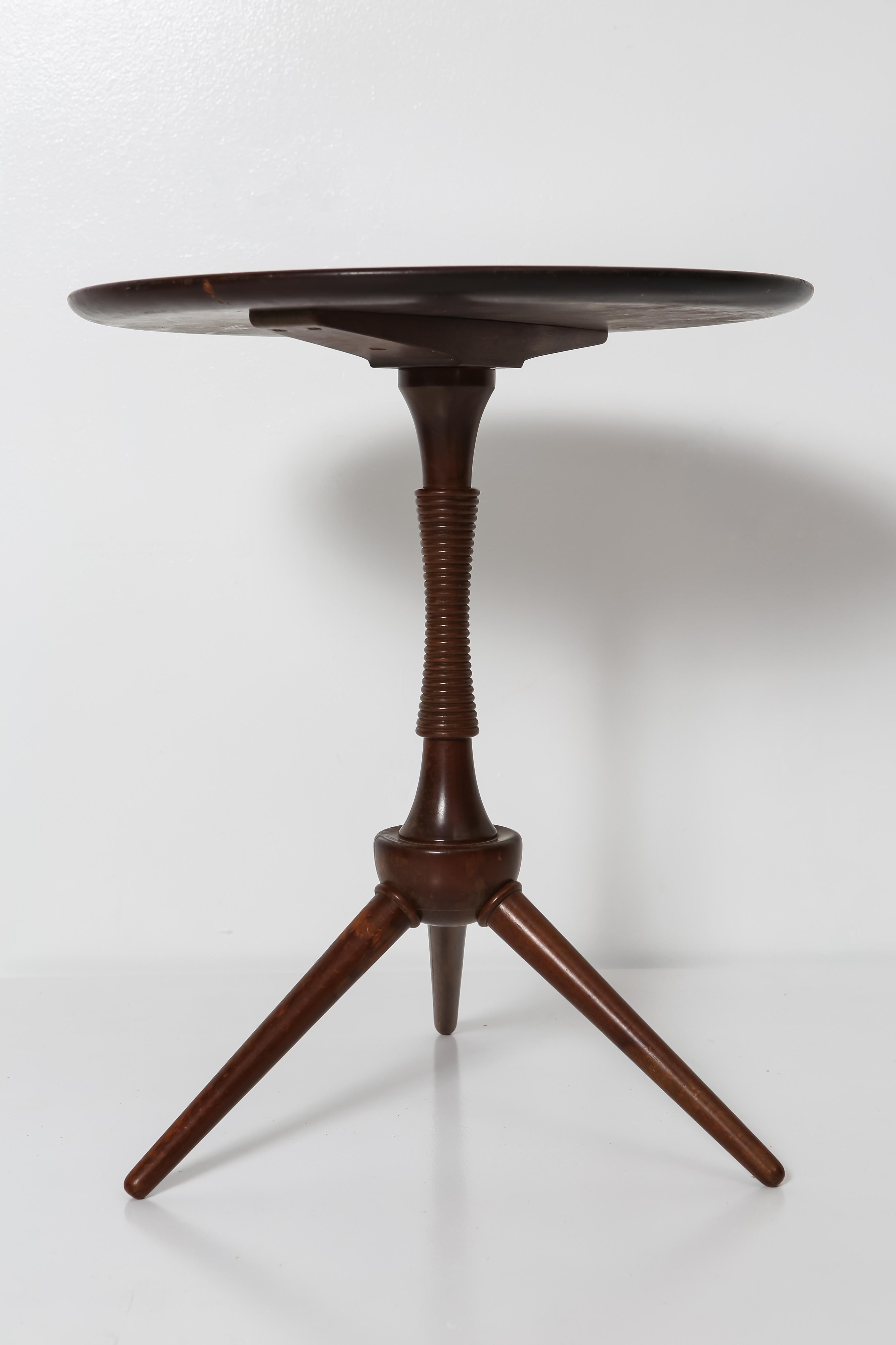 Elegant and charming, this round drink table is an uncommon find. Designed by Frits Henningsen and made in Denmark circa 1930s, it retains its original dark stained beech finish and has wonderful age-appropriate patina. It’s the perfect little side