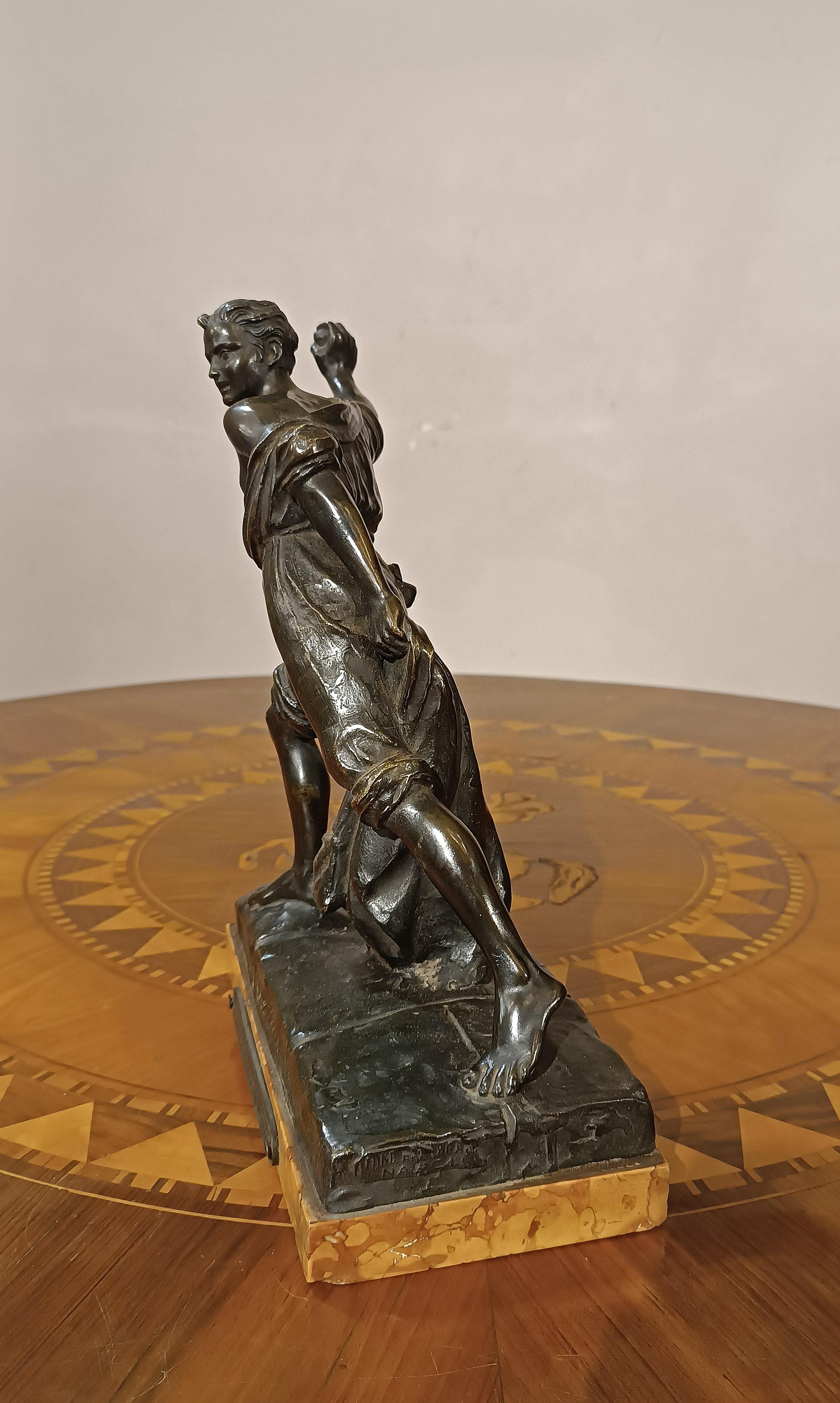 A delightful lost-wax cast bronze statue, made for the Chamber of Commerce of Genoa, as indicated by the plaque, to commemorate a famous heroic act in Genoese history. On the front, a graffito reads 