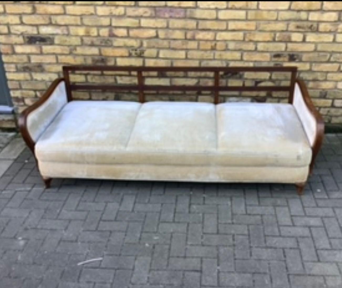 Super comfortable German sofa deep seating which makes it easy to use. this.
Item as a daybed. Lovely curved arms.