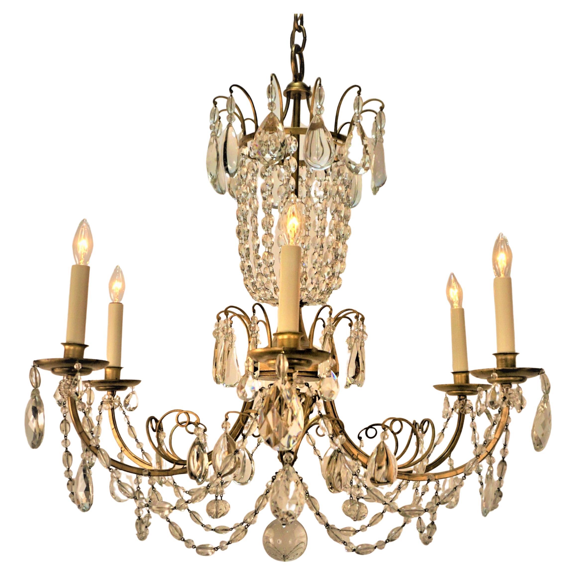 1930's Gilt Iron Crystal Chandelier For Sale