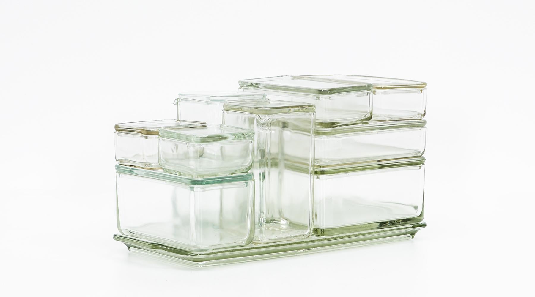 Kubus, storage container, glass, stackable with top, Wilhelm Wagenfeld, Germany, 1938

The famous storage container set for food by Wilhelm Wagenfeld. It is a design from circa 1938, an early version. All 10 containers come with a top and are