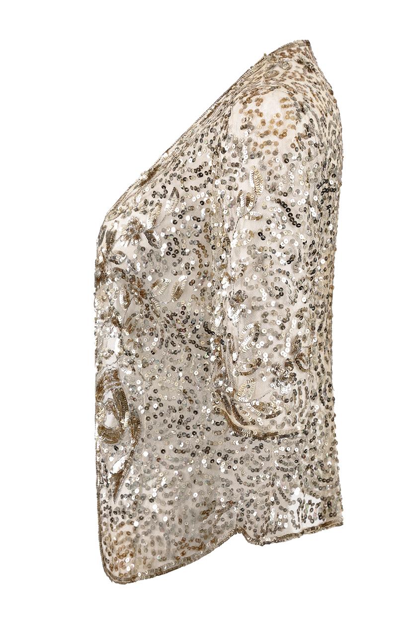 This exquisite 1930s gold sequin sheer net jacket with 3/4 length sleeves is a rare find and is in absolutely exceptional vintage condition. Collarless and designed to be loose fitting, the soft net fabric falls open over the bust with very subtle