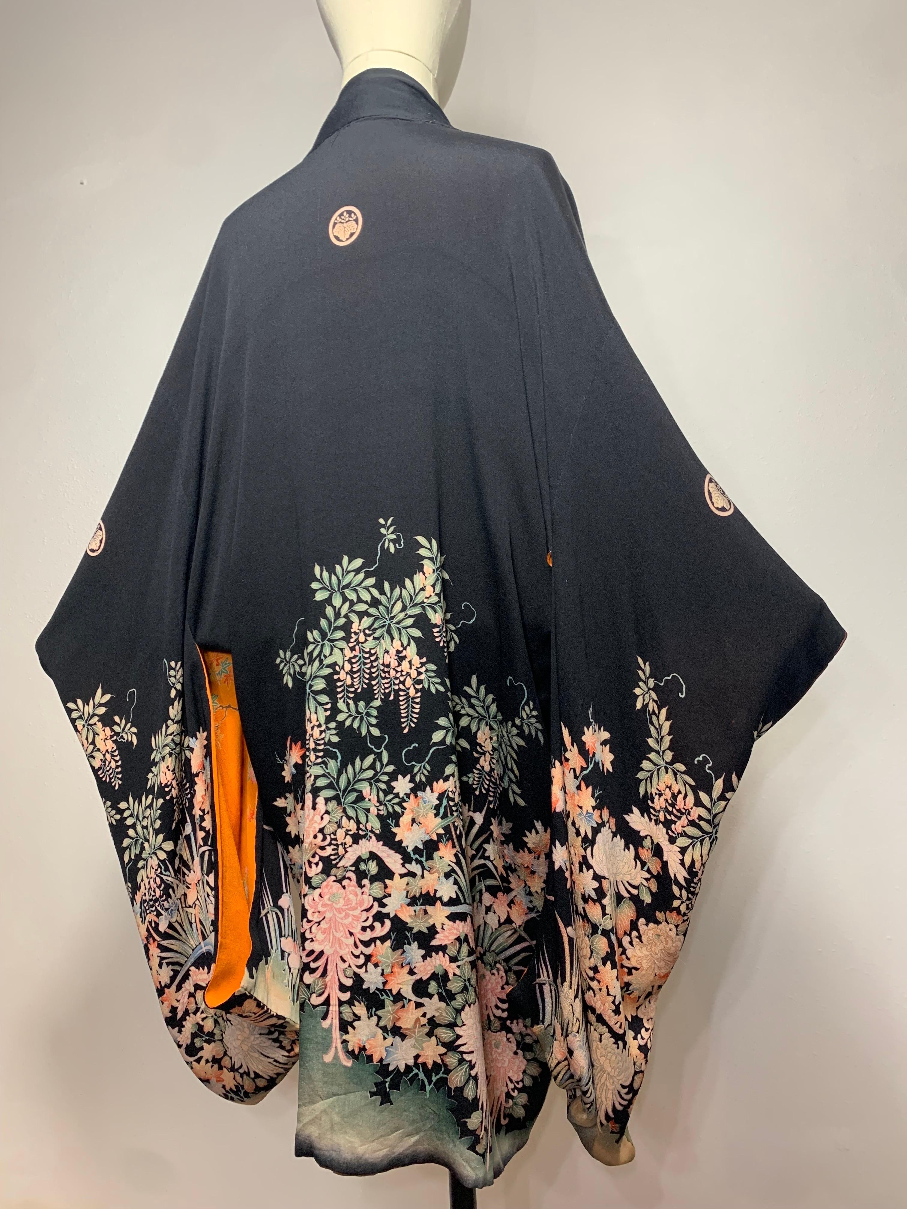 1930s Gorgeous Completely Reversible Silk Print Kimono in Marigold, Black and Chocolate Brown: This unusual and rare kimono is knee-length with equally stunning patterns on either side. One side is black with wisteria and chrysanthemum print at hem.