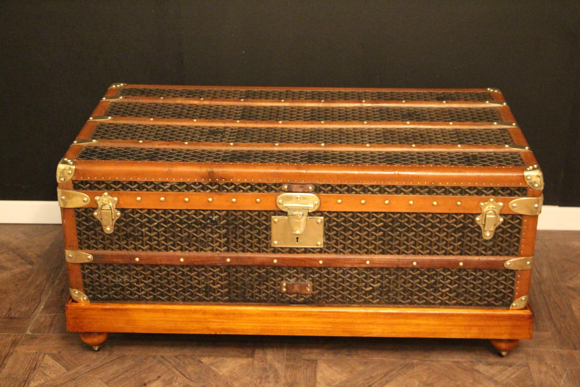 This Goyard steamer trunk features the very sought after chevrons canvas as well as all solid brass fittings: Goyard marked side handles and locks. Goyard plaques on each side. Brass studs. Many wood slats. Beautiful and rich patina. Customized