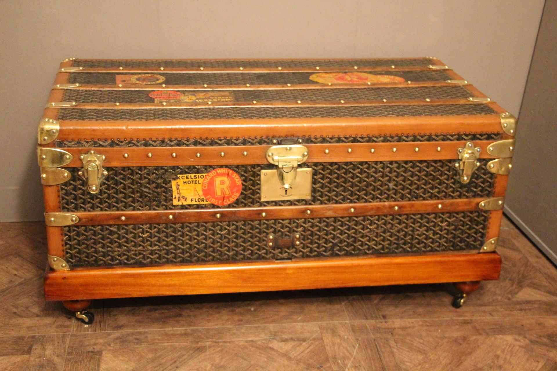 This Goyard steamer trunk features the very sought after chevrons canvas as well as all solid brass fittings: Goyard marked side handles and locks. Goyard plaques on each side. Brass studs. Many wood slats. Beautiful and rich patina. A couple of