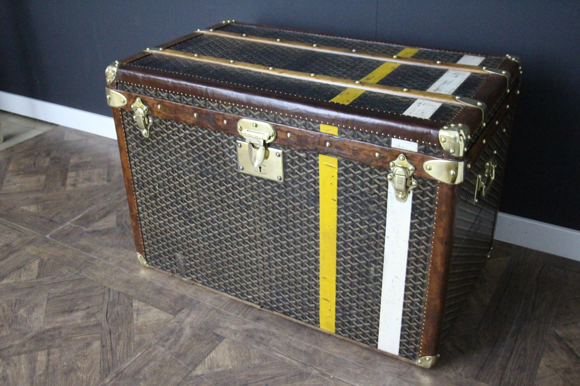 This magnificent Goyard hat trunk features the very sought after chevrons pattern canvas, two Goyard stamped solid brass side handles, solid brass corners and Goyard engraved brass locks. Its all leather trim color is warm chocolate brown .It also