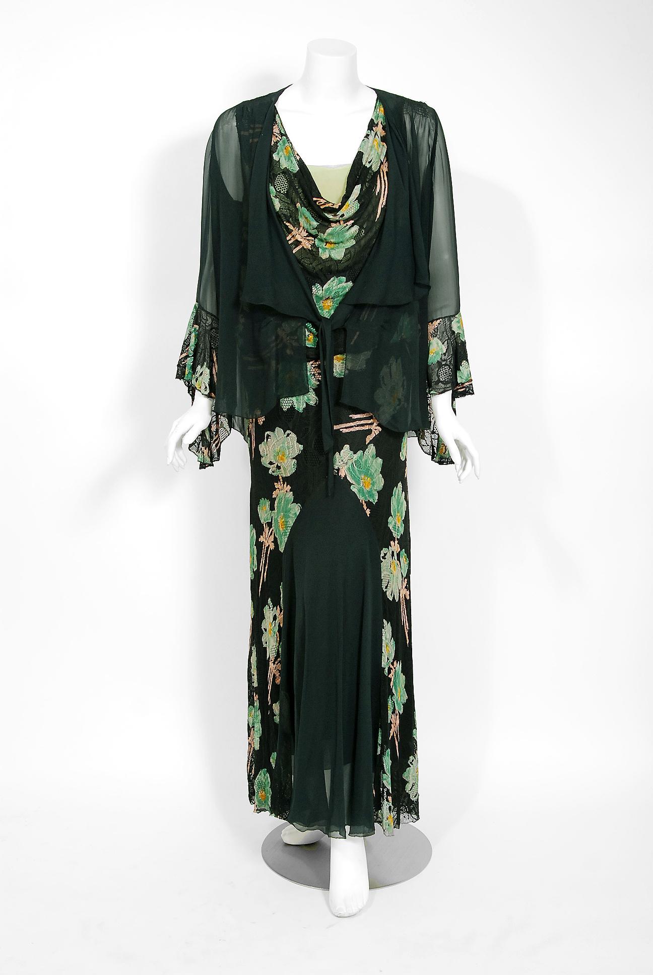 The breathtaking large-scale green black floral garden deco print used on this 1930's lace and silk-chiffon gown ensemble has a timeless allure that I find irresistible. The bodice is a low plunge cowl-neck sleeveless. The elegant blousy waist falls