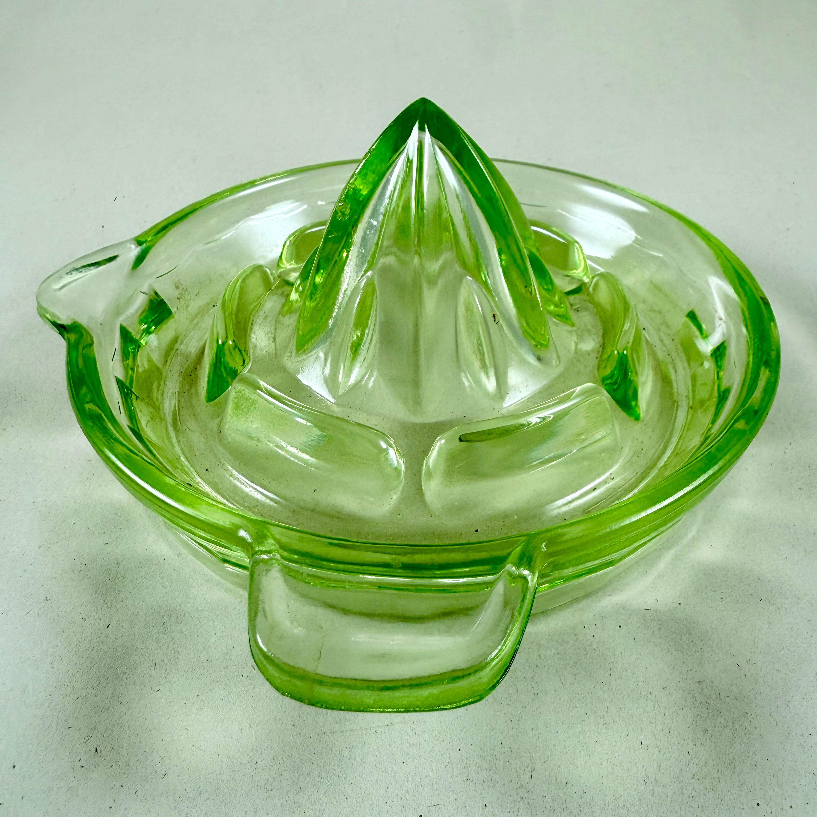 A large green Uranium glass citrus reamer or juicer, attributed to Anchor Hocking Glass – circa 1930s.

Uranium reamers typically have a greenish hue and glow brightly under ultraviolet light, such as a blacklight. They contain a small amount of