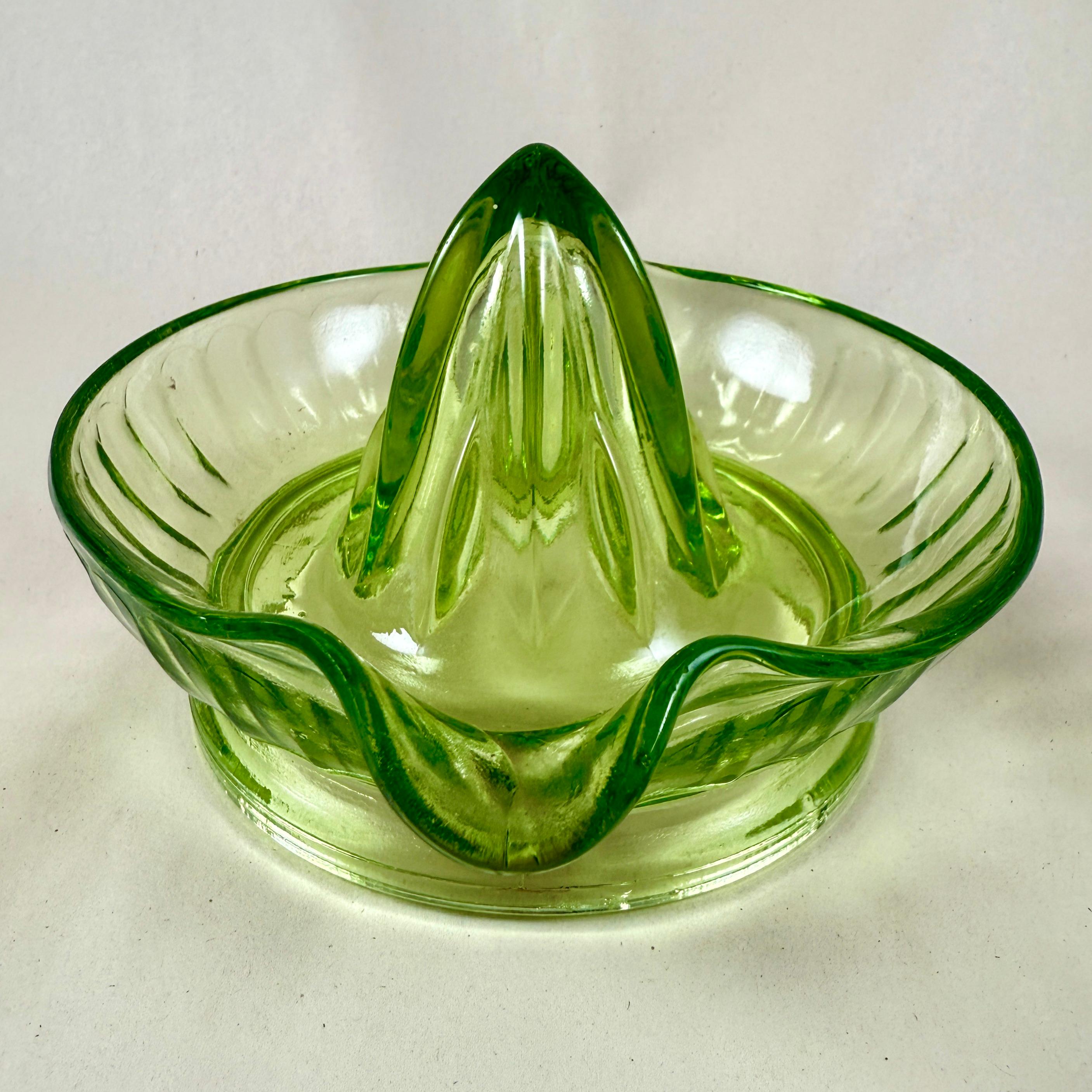 
A large green Uranium glass citrus reamer or juicer, attributed to Hazel Atlas Glass – circa 1930s.

Uranium reamers typically have a greenish hue and glow brightly under ultraviolet light, such as a blacklight. They contain a small amount of