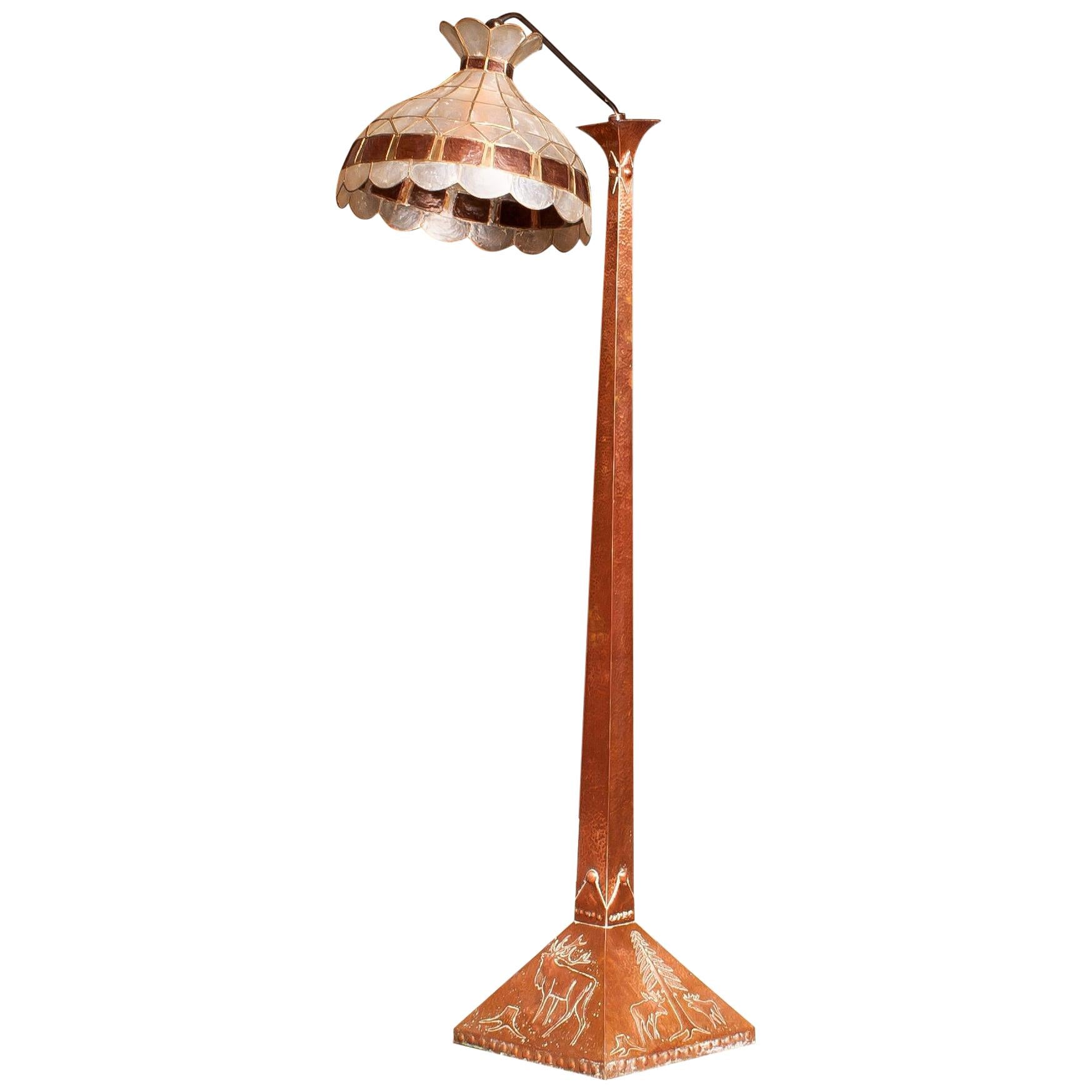 This exceptional rare floor light in Jugendstil is fully made by hand in Sweden and in beautiful condition.
In the base are typical Swedish images hammered on all four sides.
Base measurements are: 36 x 36 cm. and the total height of the floor
