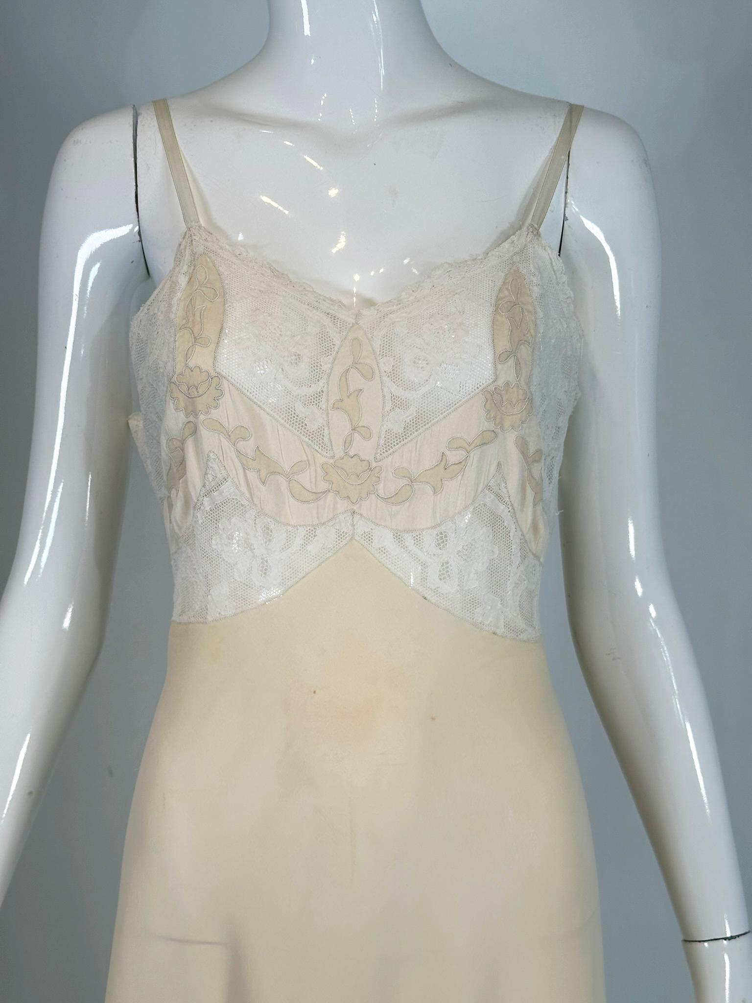 1930s Hand made cream silk chiffon, bobbin lace, applique & embroidered bias cut slip. Beautiful hand made slip in translucent cream silk chiffon, V neckline, the bodice is done in hand made needle point lace, the center front & cup fronts have silk