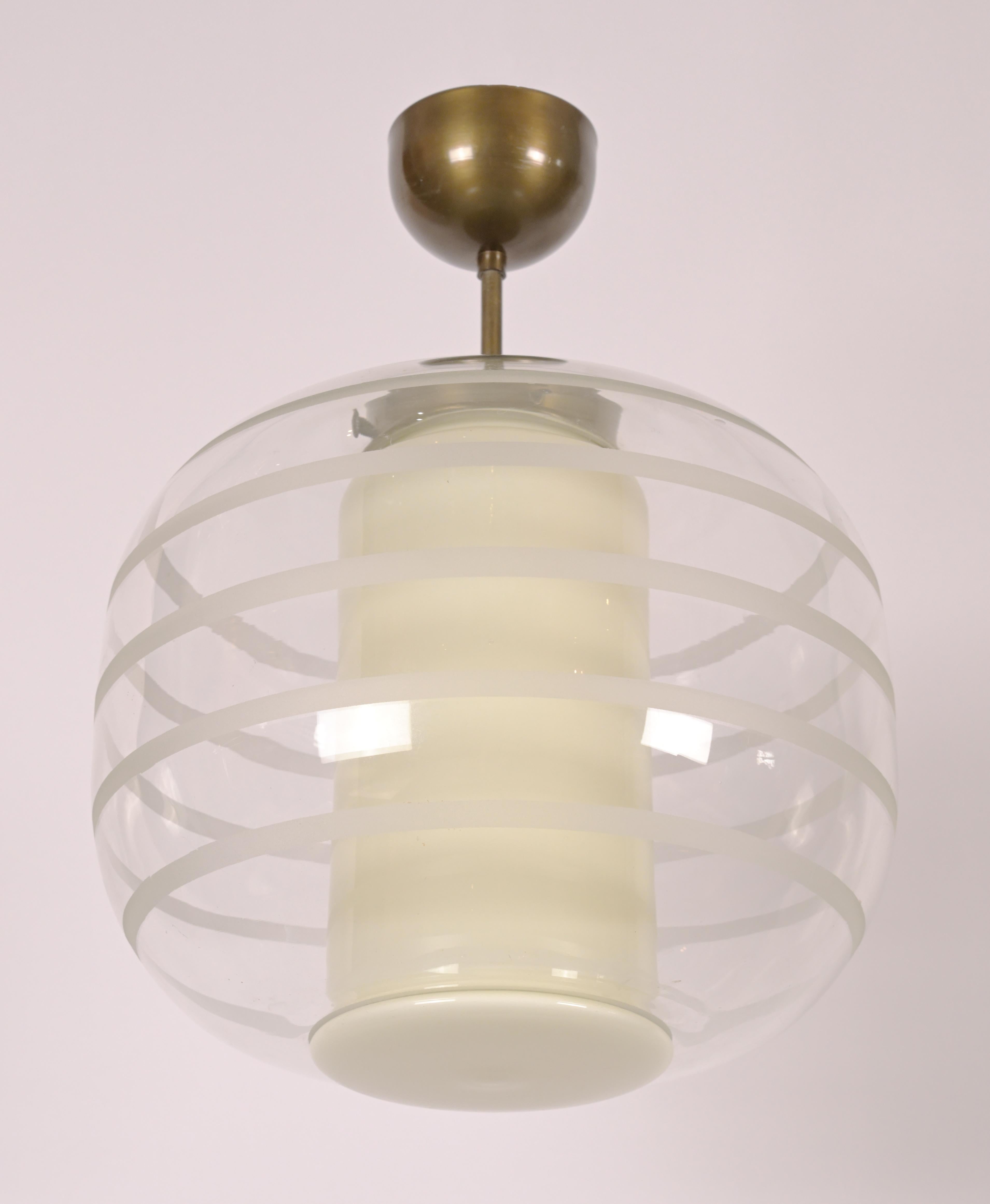 A glass striped sandblasted ceiling lamp designed by Swedish artist Harald Notini (1879 - 1959). Price includes UL wiring.