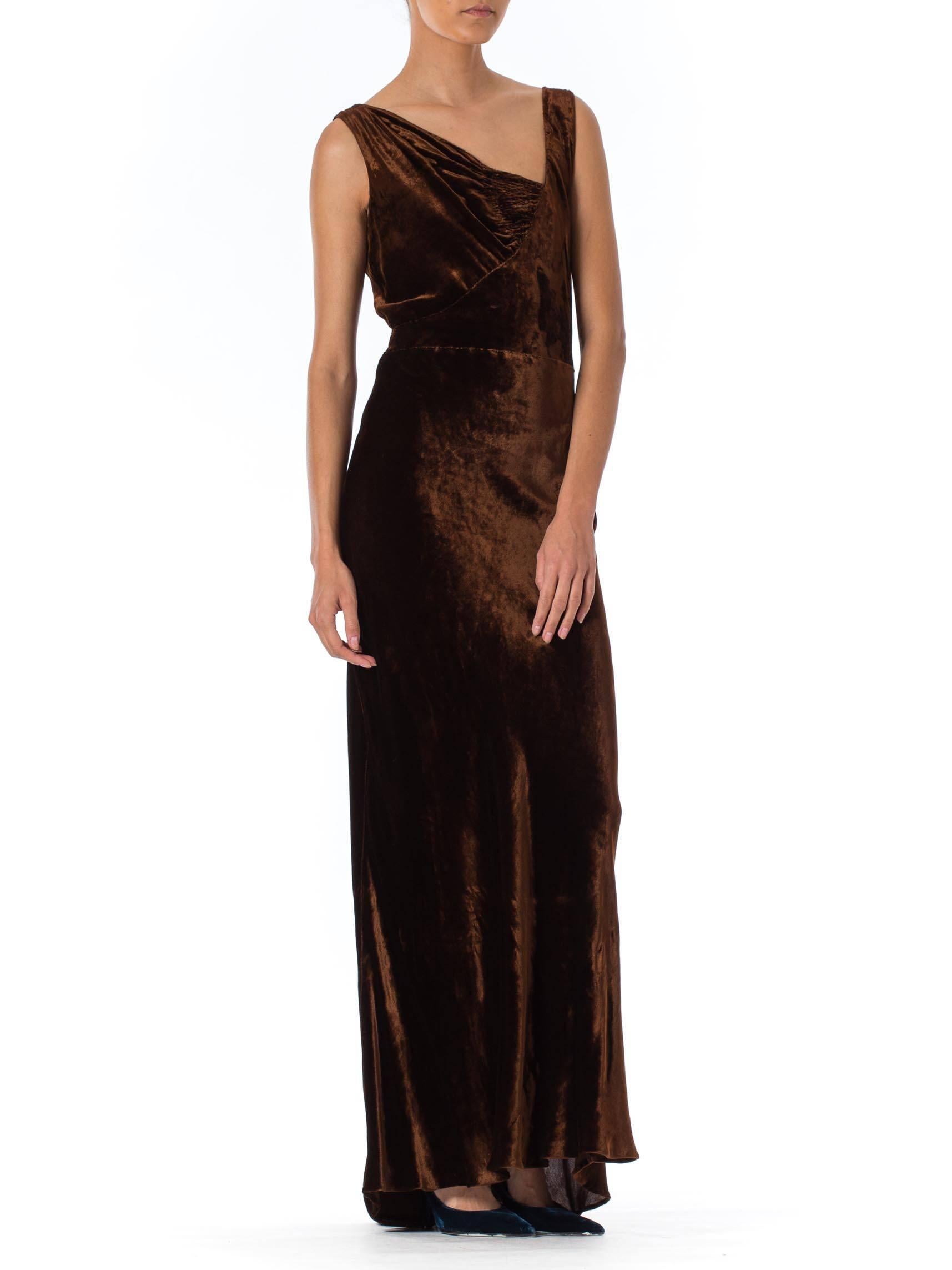 The beautiful bias cut to this gown allows it to go from a double 0 up to a size 4 1930S HARRODS Chocolate Brown Asymmetrically Draped Bias Silk Velvet Gown