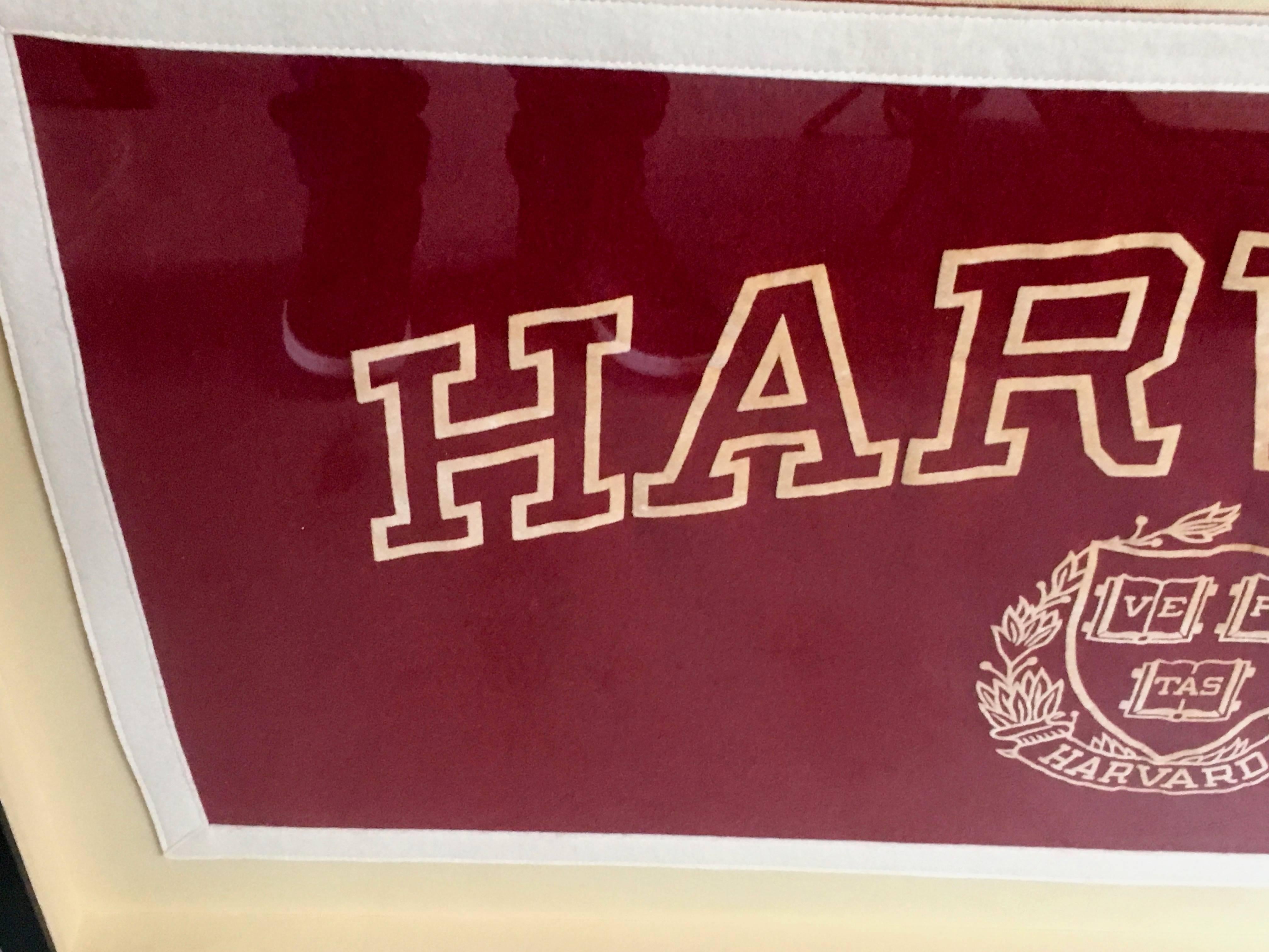 Unique Harvard University school banner from the 1930s. Great piece of Americana. Original red and white coloring with great patina. Hand stitched. Newly framed and mounted on linen backing.

Dimensions of banner are 16.5