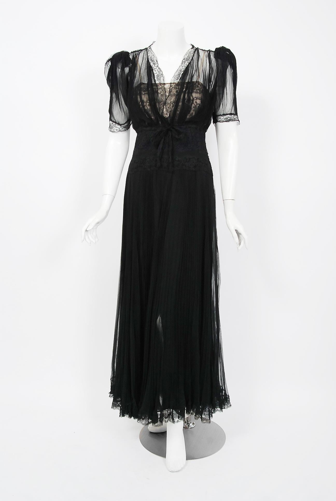 Breathtaking Hattie Carnegie Couture black semi-sheer dress dating back to her 1938 partership with Swanson. The name Hattie Carnegie is very often associated with elegance and high fashion. Carnegie’s fashion philosophy is summed up as 