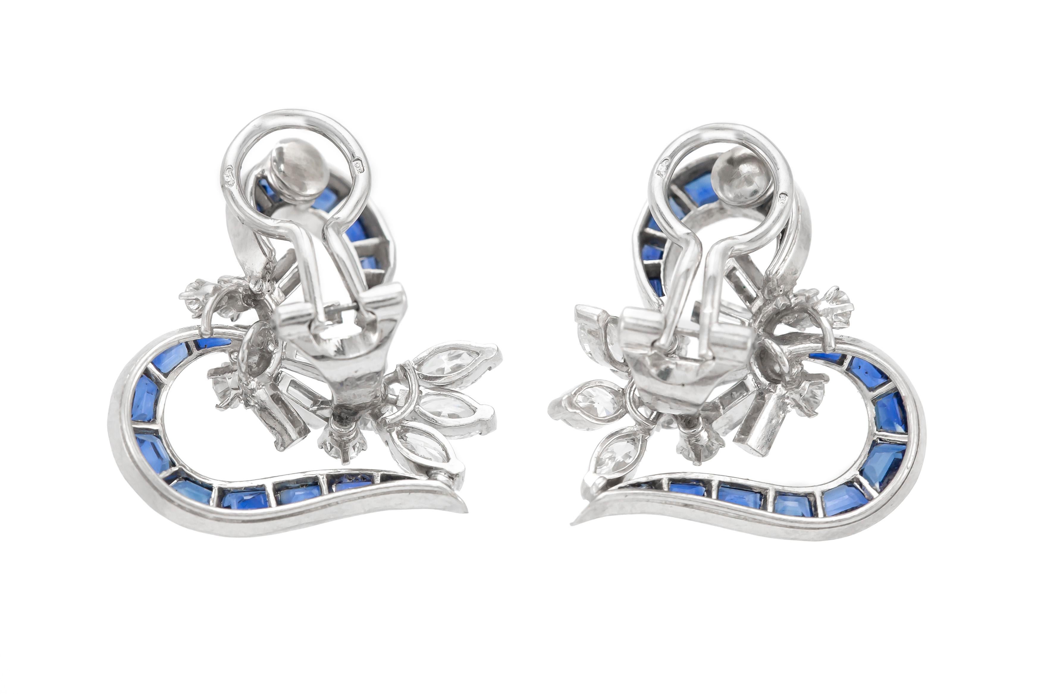 Beautiful heart like shaped clip on earrings are finely crafted in platinum. The diamonds weigh a total of approximately 2.00 carat. The sapphire weigh a total of approximately 6.00 carat. Circa 1930.