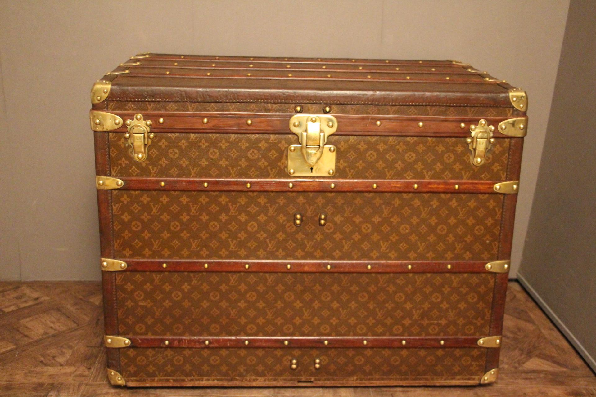 Exceptional and rare Louis Vuitton high steamer trunk featuring stencilled canvas, all leather trim, solid brass Louis Vuitton stamped clasps and lock, solid brass corners and solid brass LV stamped side handles.
No painted stripes and no painted