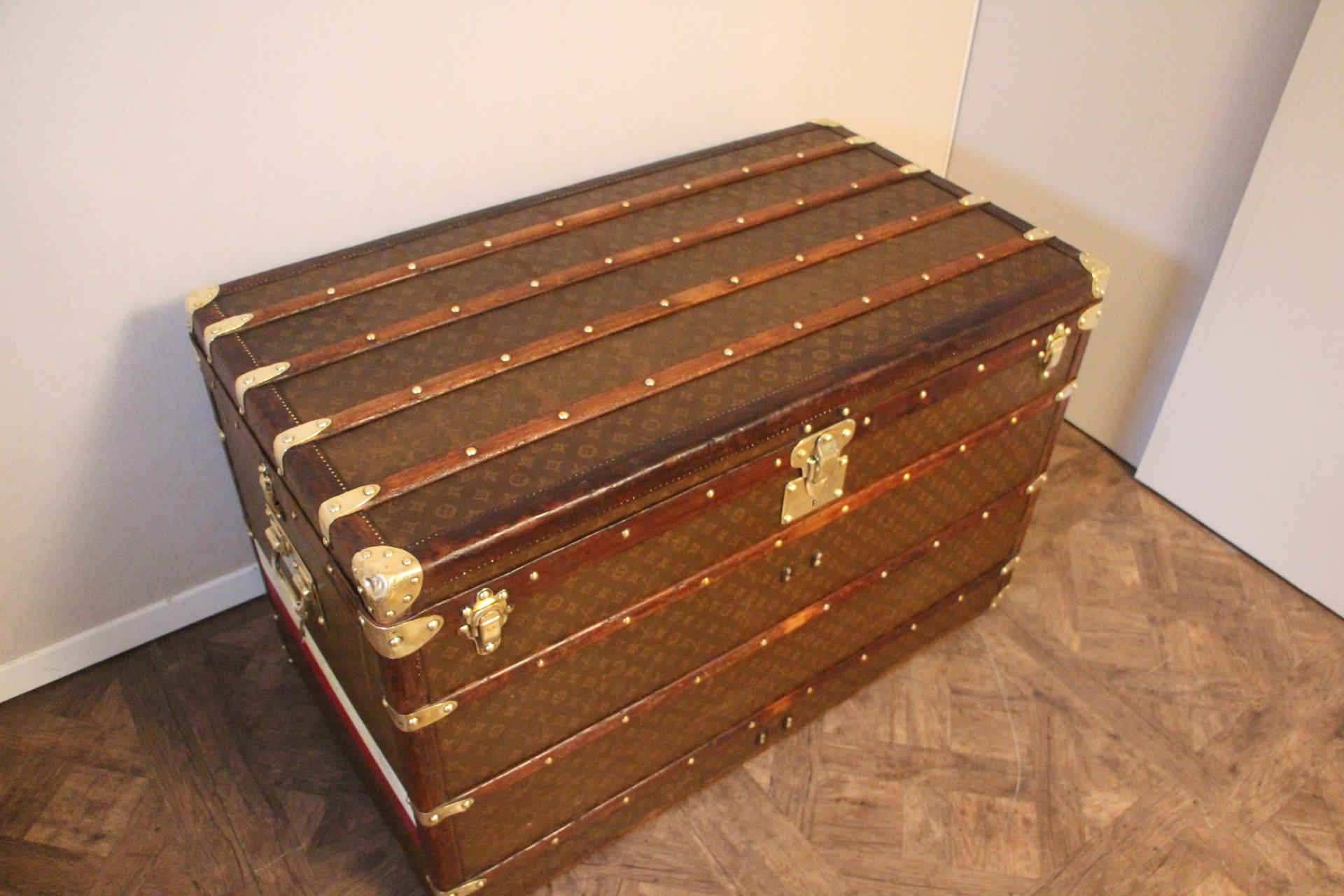 Exceptional and rare Louis Vuitton high steamer trunk featuring stencilled canvas, all leather trim, solid brass Louis Vuitton stamped clasps and lock, solid brass corners and solid brass LV stamped side handles.
Painted stripes on the sides. Very