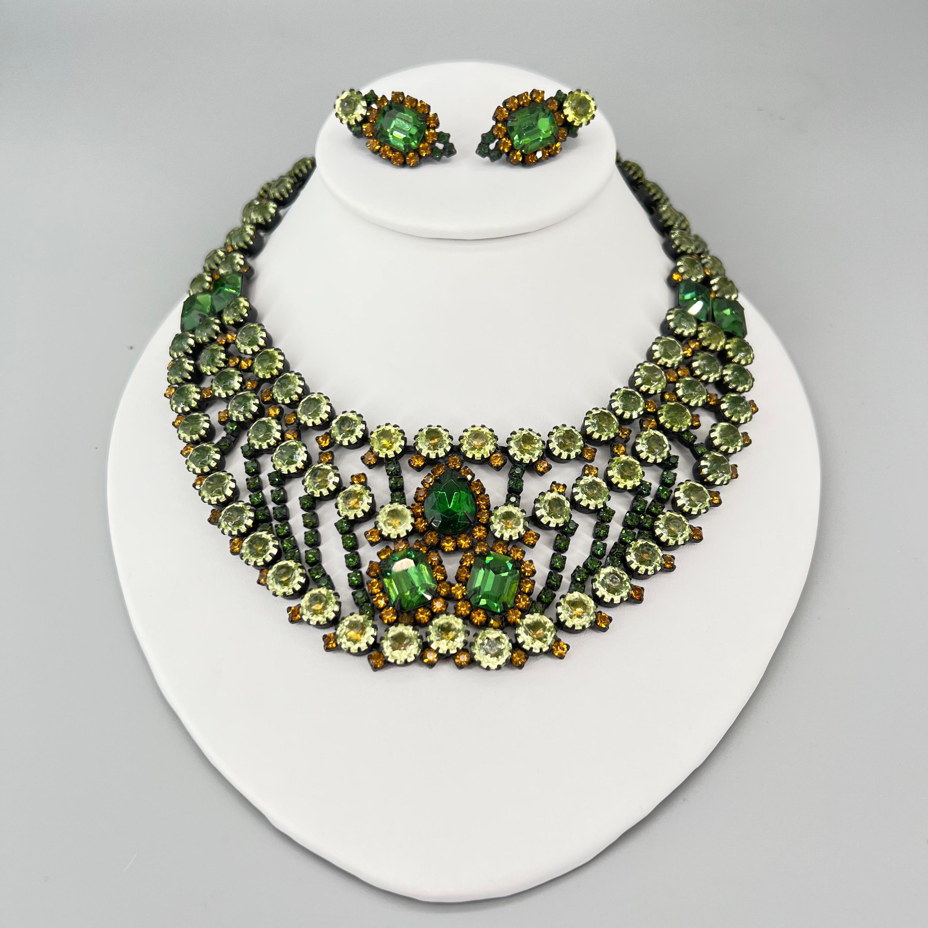 Black Japanned Prog setting filled with Emerald, Peridot, and Citrine Rhinestones in Round, Emerald and Teardrop Cut. The Citrine Rhinestones are Vaseline Glass and Glow Brilliantly under UV light. Oversized stones and incredible detail make this