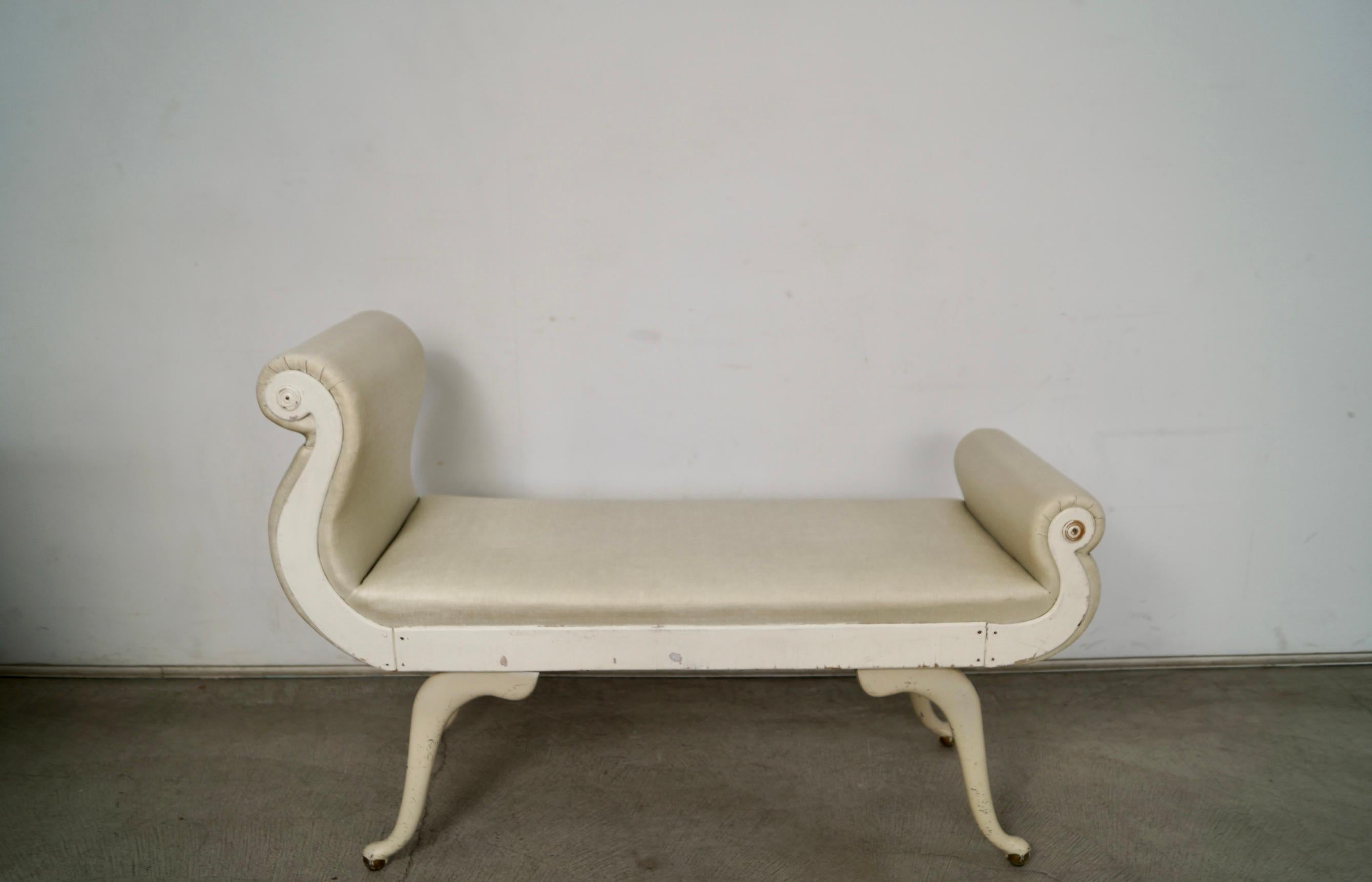 Antique 1930's Hollywood Regency bench for sale. It's a very special and unique bench that was manufactured by Irving Chase, and has a great design. It has a scroll arm design with one side taller than the other, and is a wide mix of materials. The