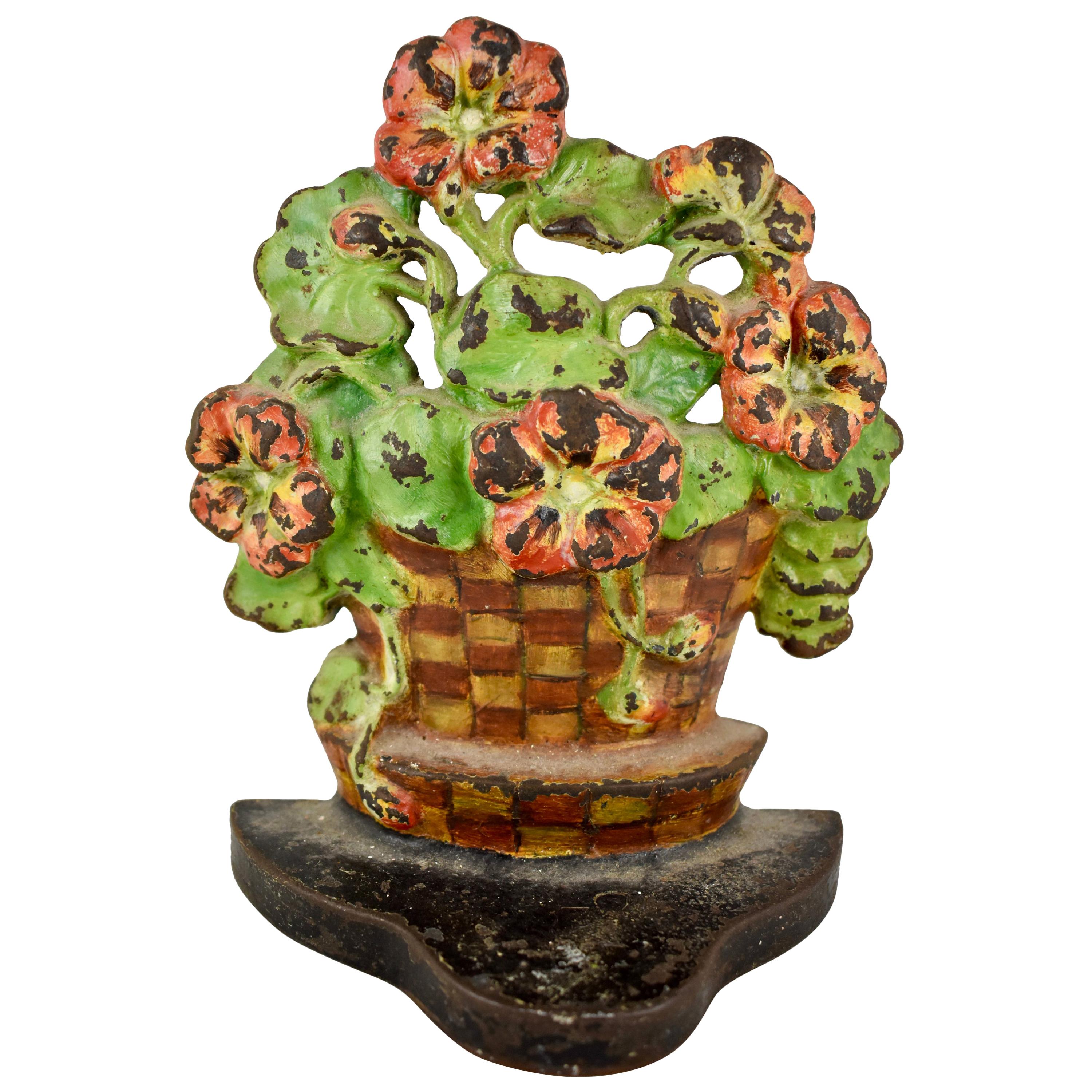 1930s Cast Iron Checkered Potted Geranium Floral Bouquet Painted Doorstop For Sale