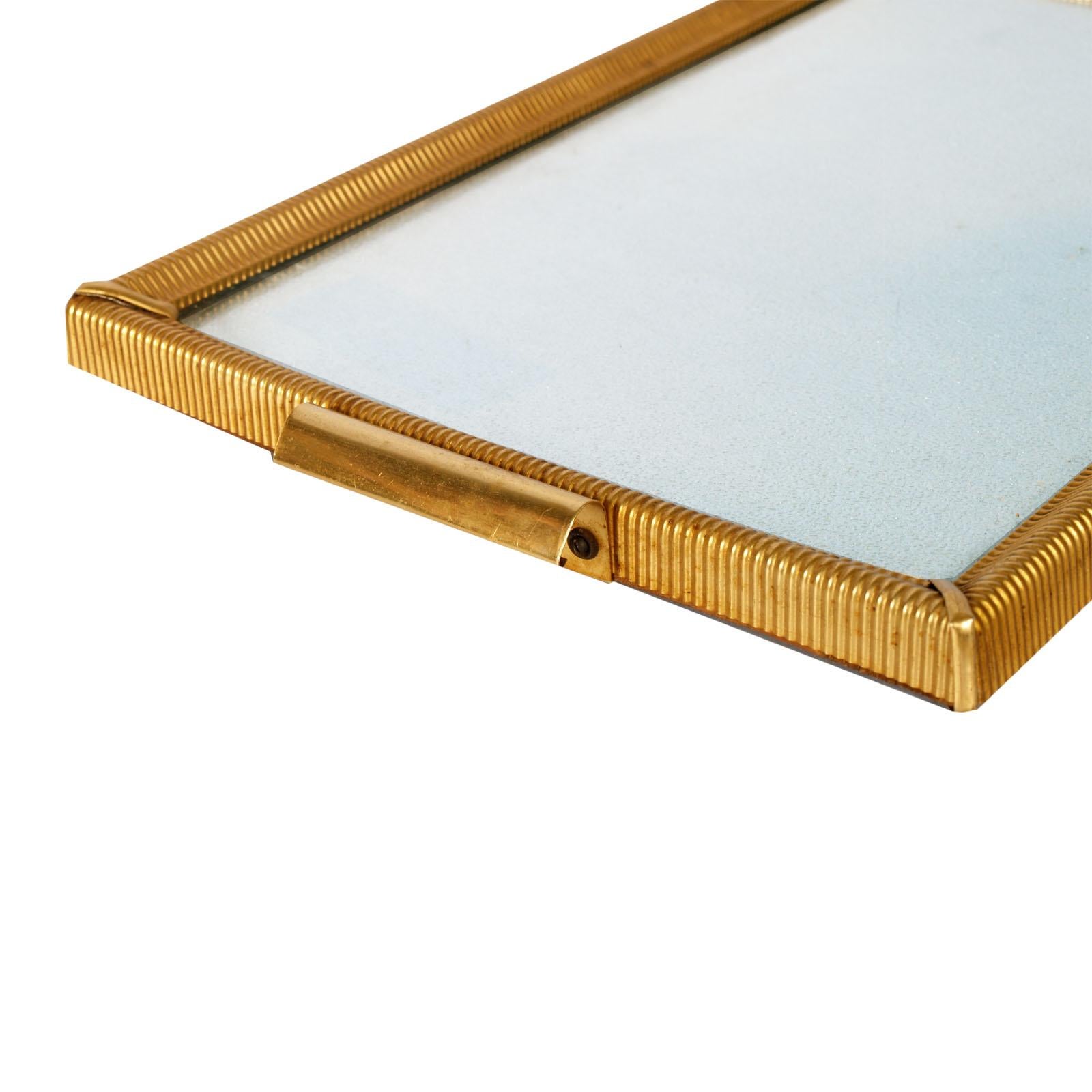 Art Decò nice serving tray, structure in gilt metal, with top cristall on a light blue embossed metal paper. Structure and the bottom of the tray in wood.