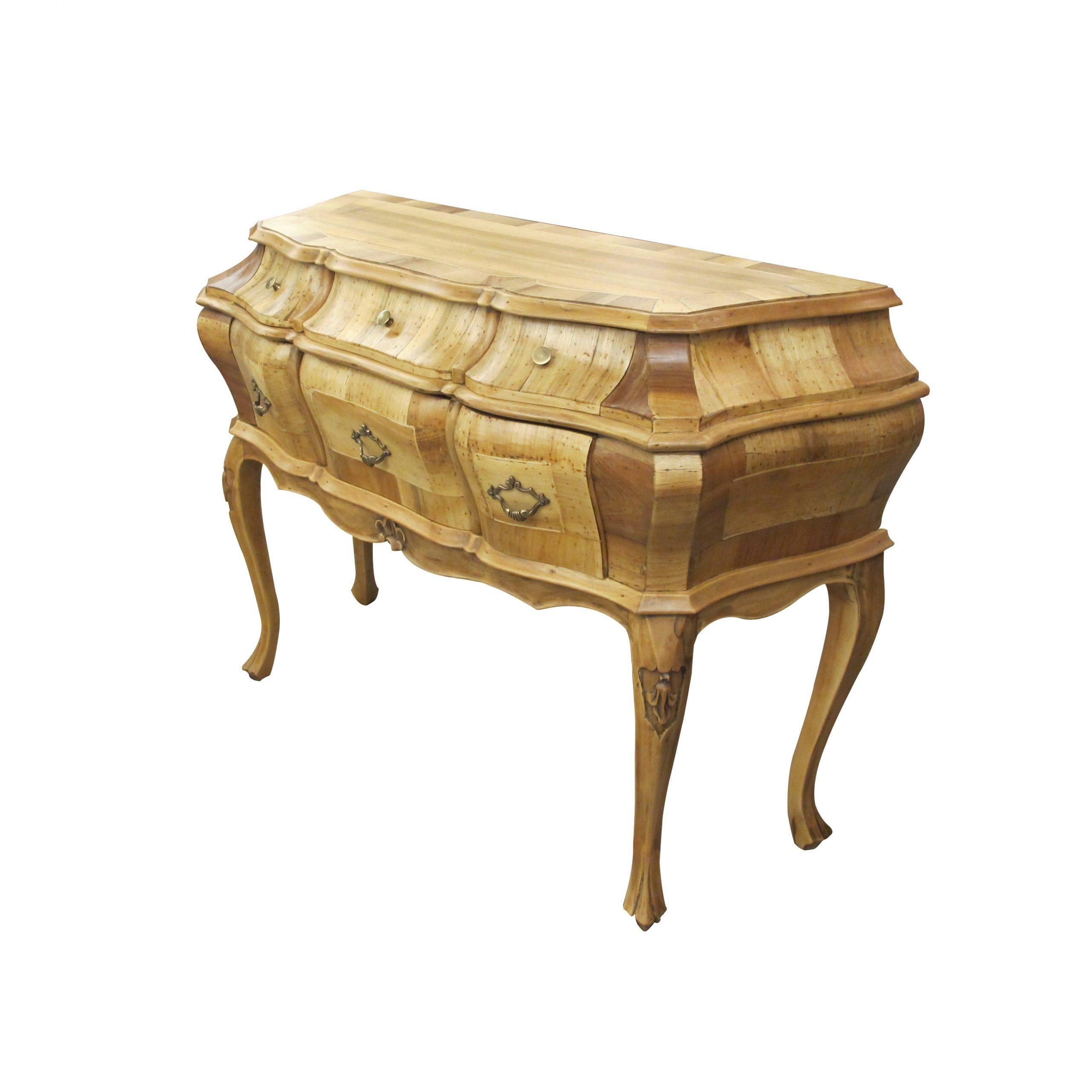 A rare 1930s Italian Baroque style bombé chest of drawers with burl olive wood and burl walnut marquetry featuring its original Art Nouveau brass handles. There are three flat brass knobs on the top set of drawers and three brass drawer pulls on the