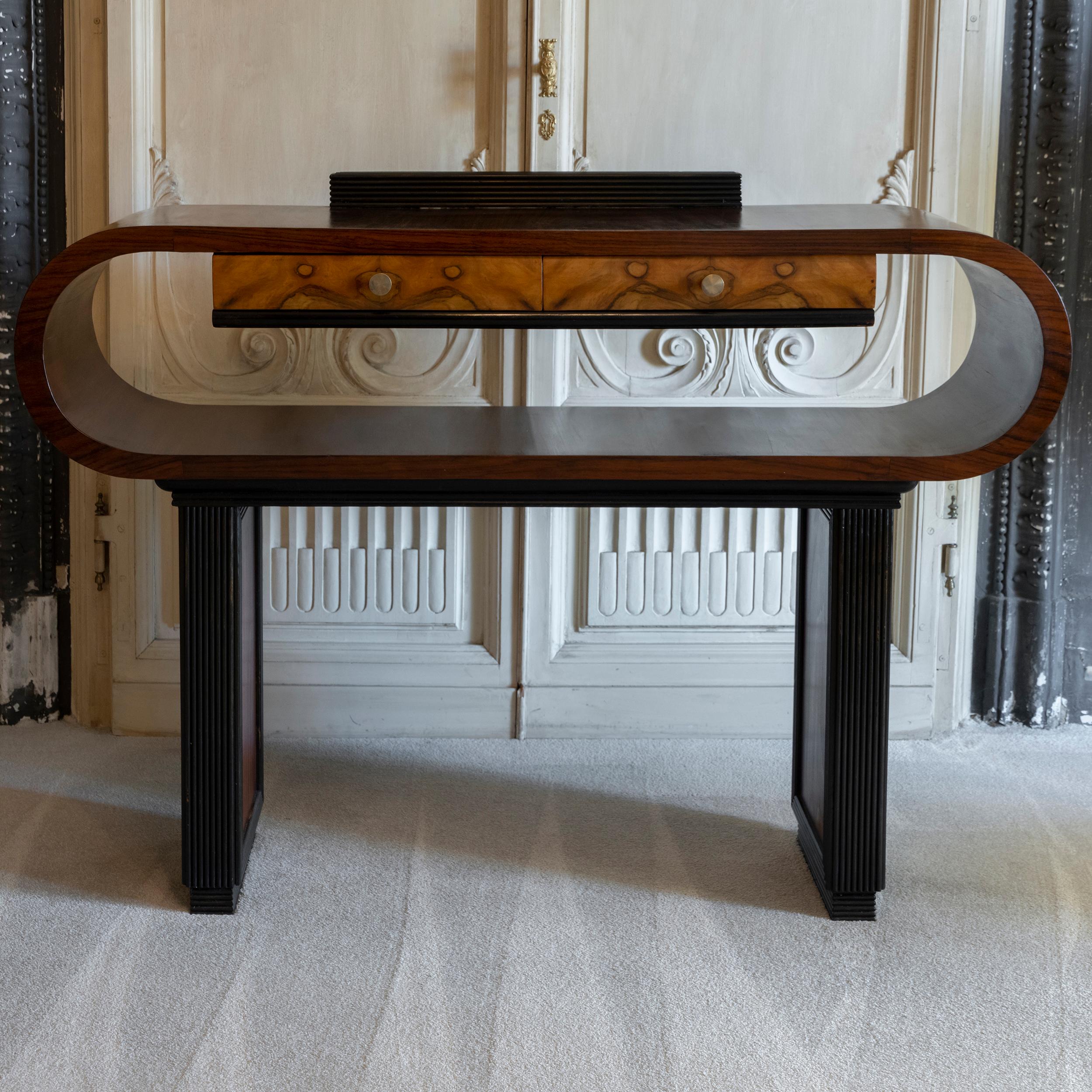 Art Deco console table in palisander, mahogany and walnut, channeled decorative details, two drawers with burlwood front, brass details, Italy 1930s circa.