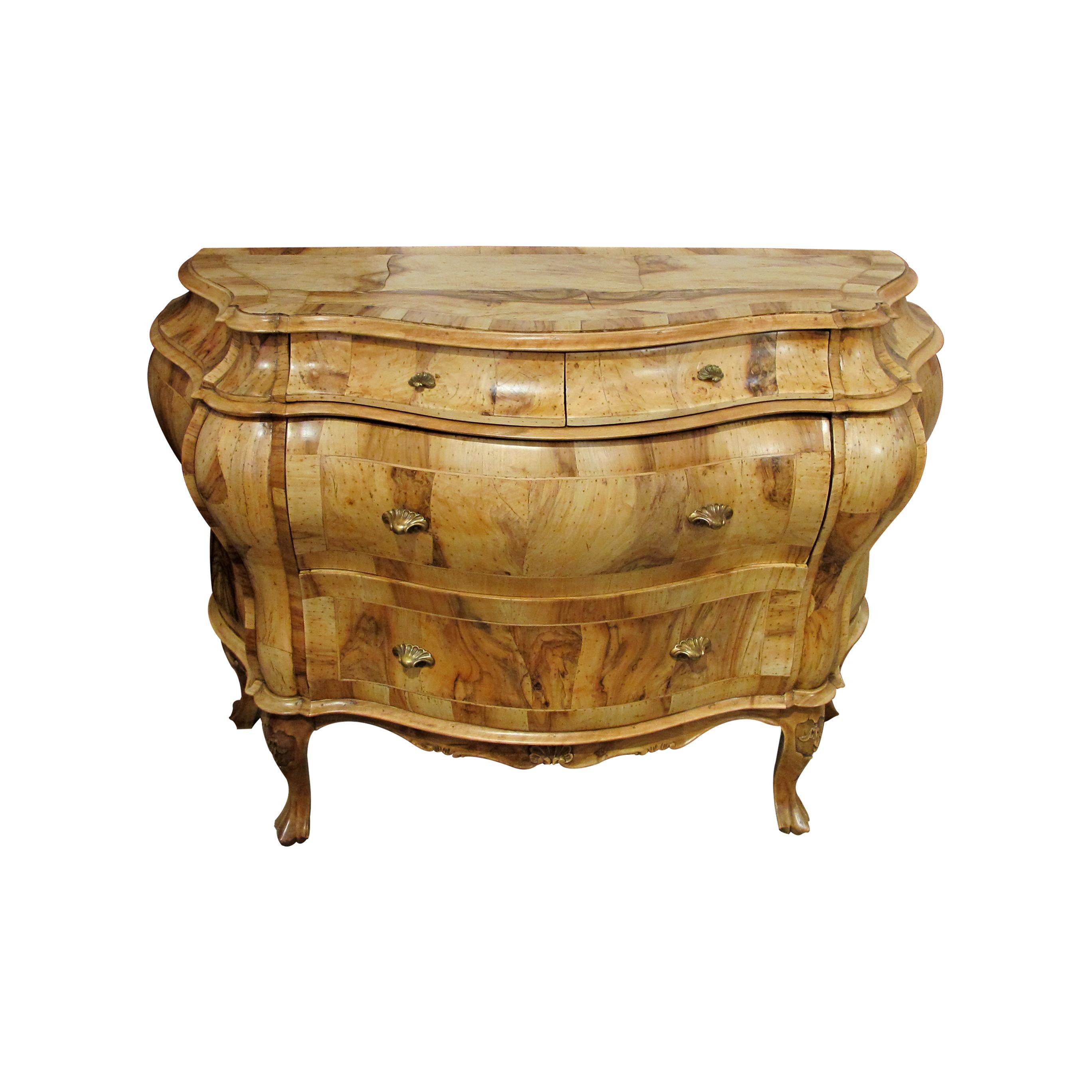 1930s Italian Baroque style bombé chest of drawers with burl olive wood and burl walnut marquetry with its original Art Nouveau brass handles. This chest boasts two large and two smaller drawers on the upper part which are incorporated with the